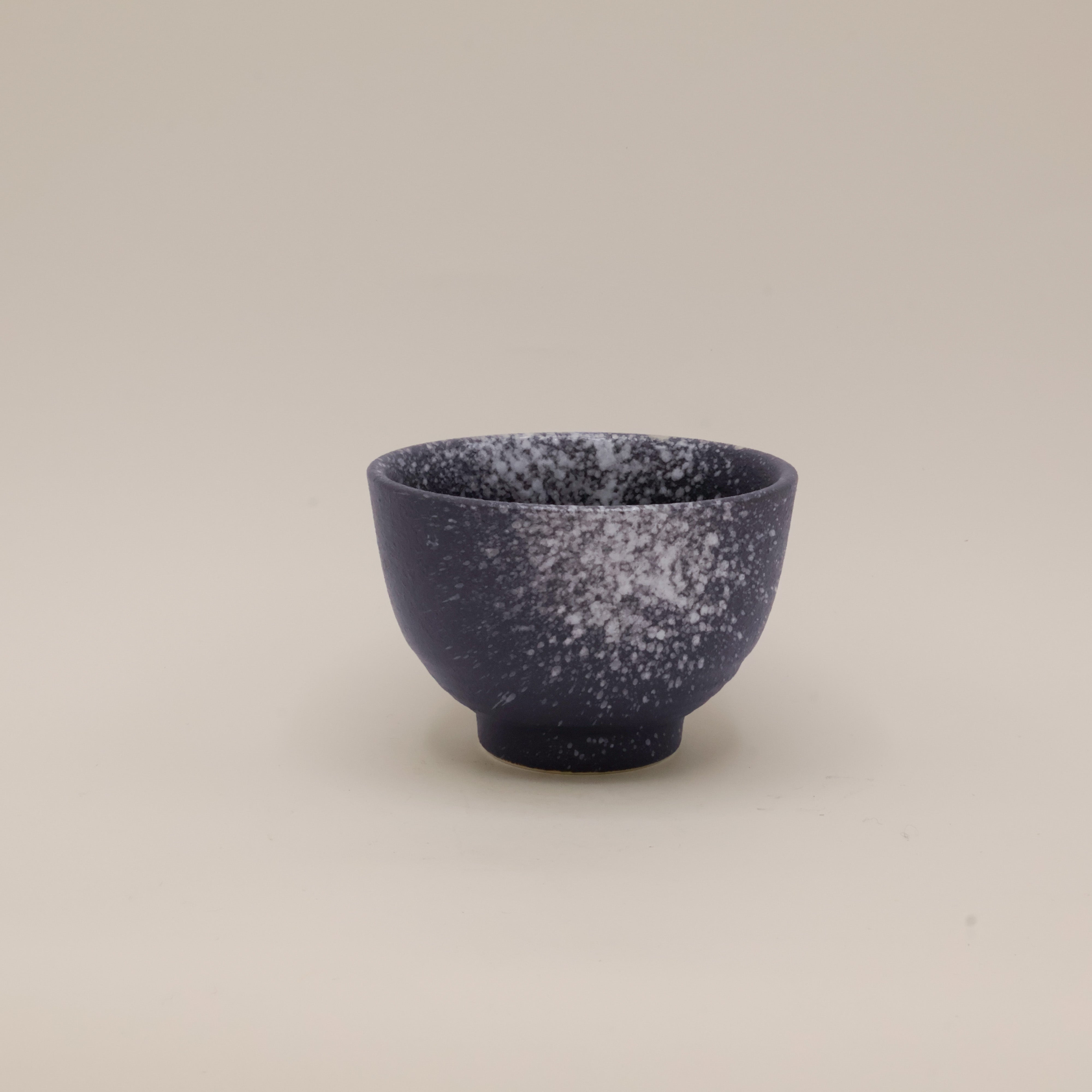 Black cup with white splash