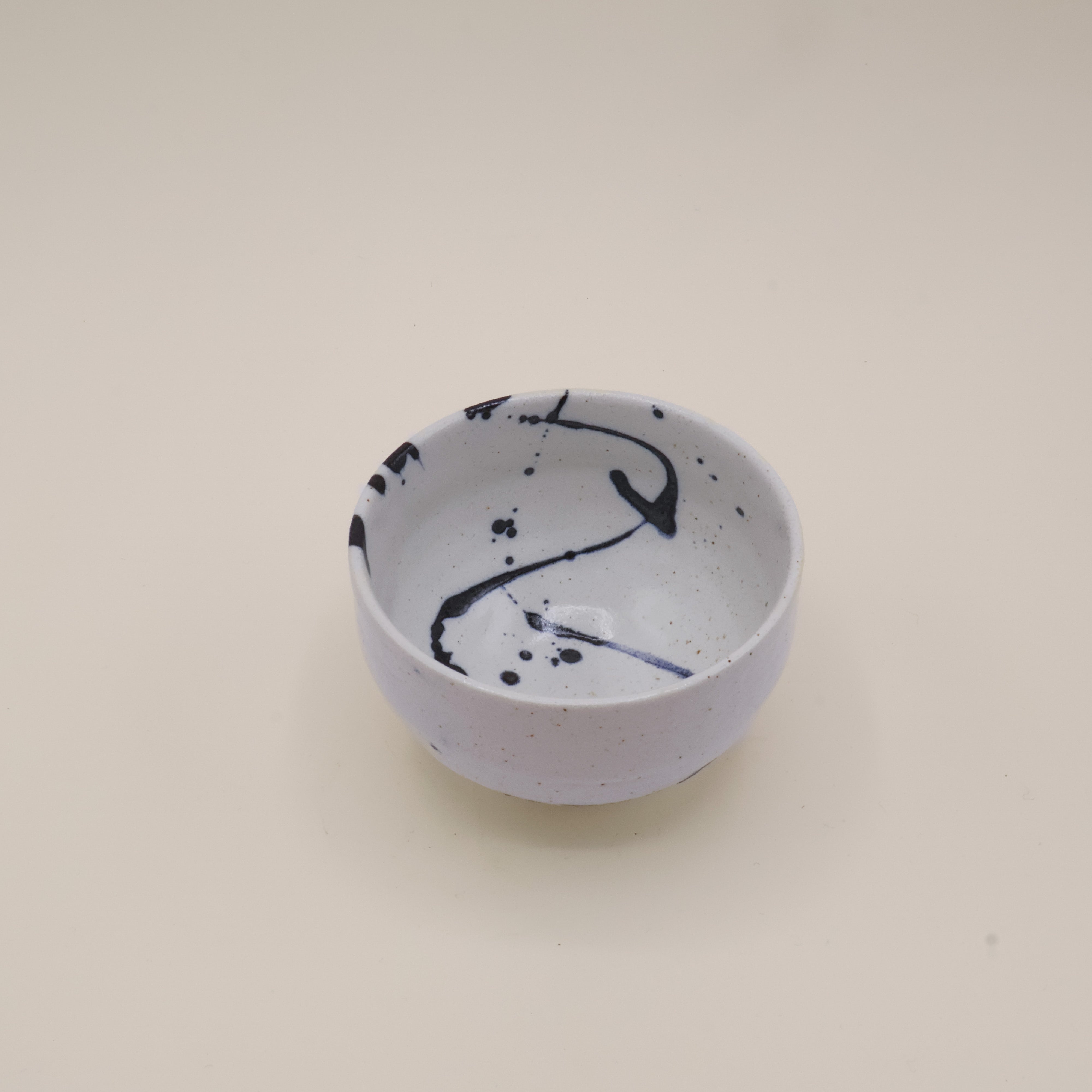 Japanese cup with blue splash pattern