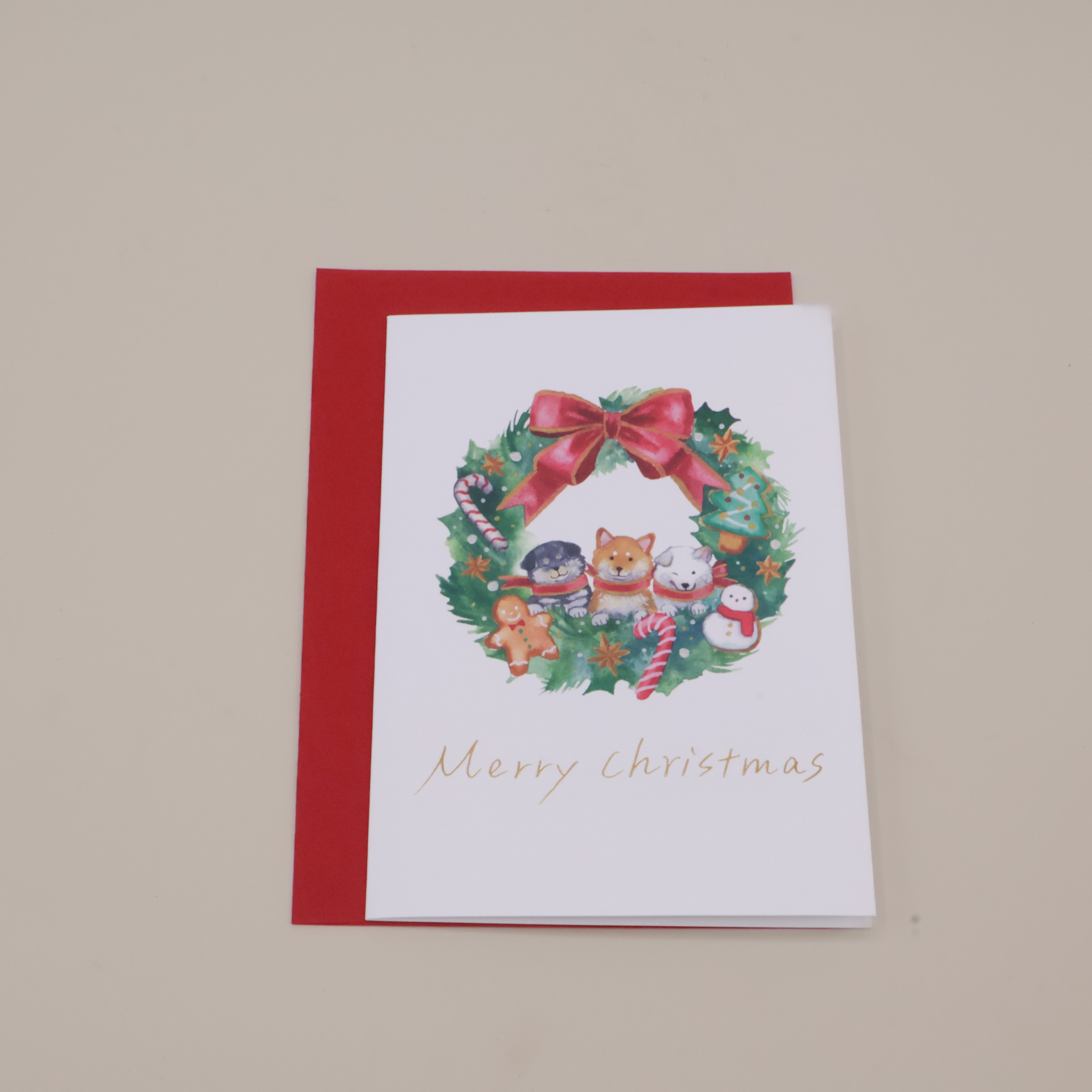 Julekort og kuvert med shibaer i adventskrans