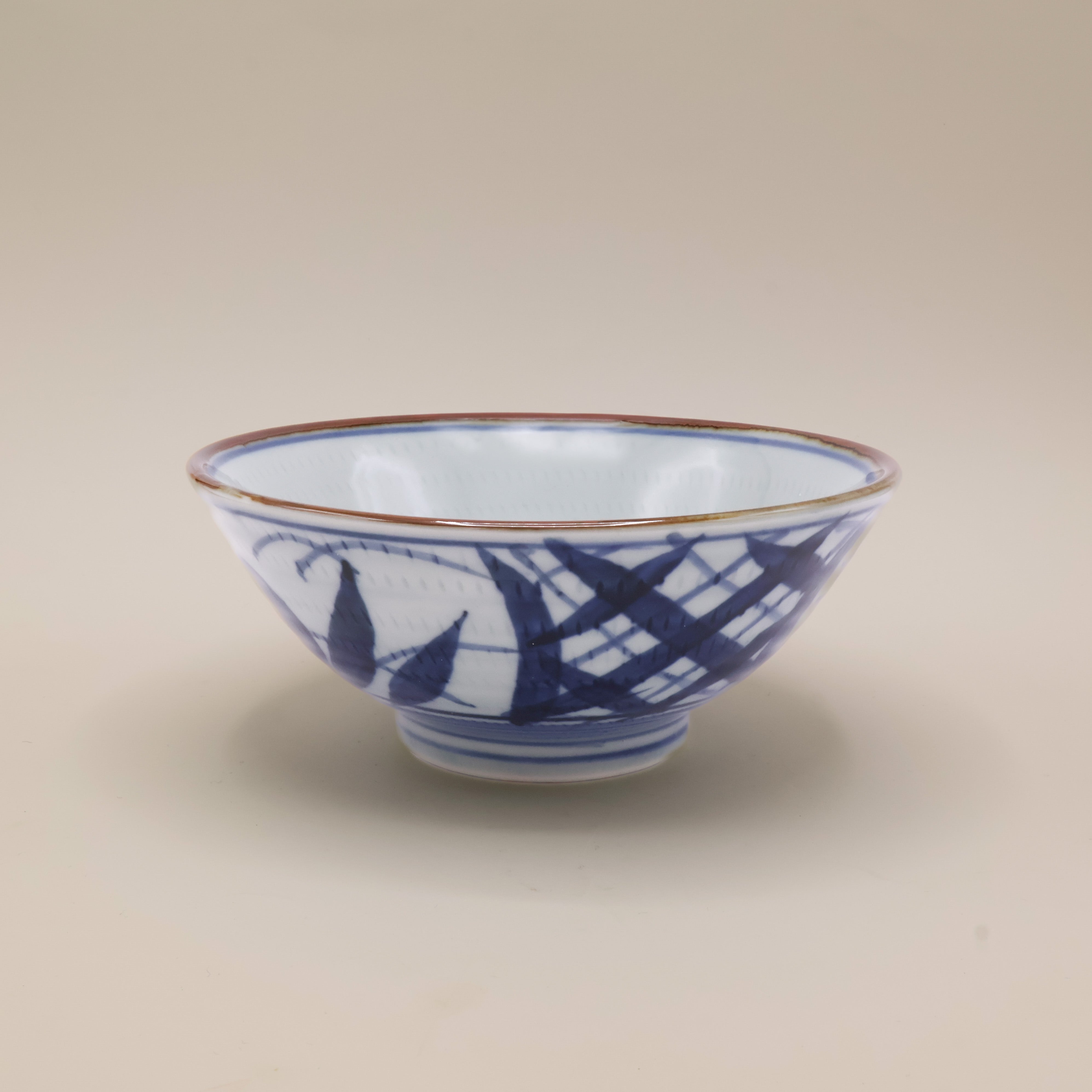 Noodle bowl with blue motif and brown rim