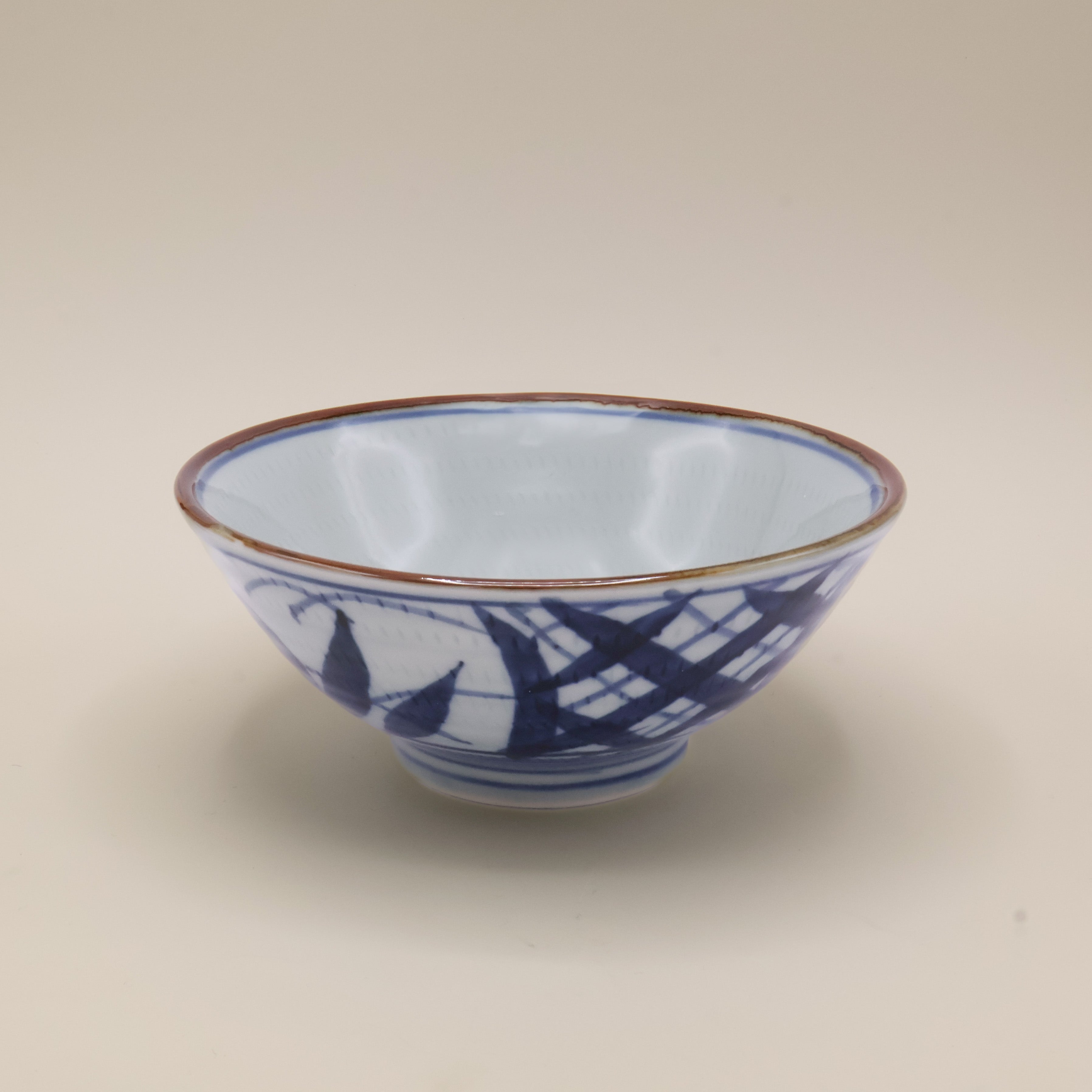 Noodle bowl with blue motif and brown rim