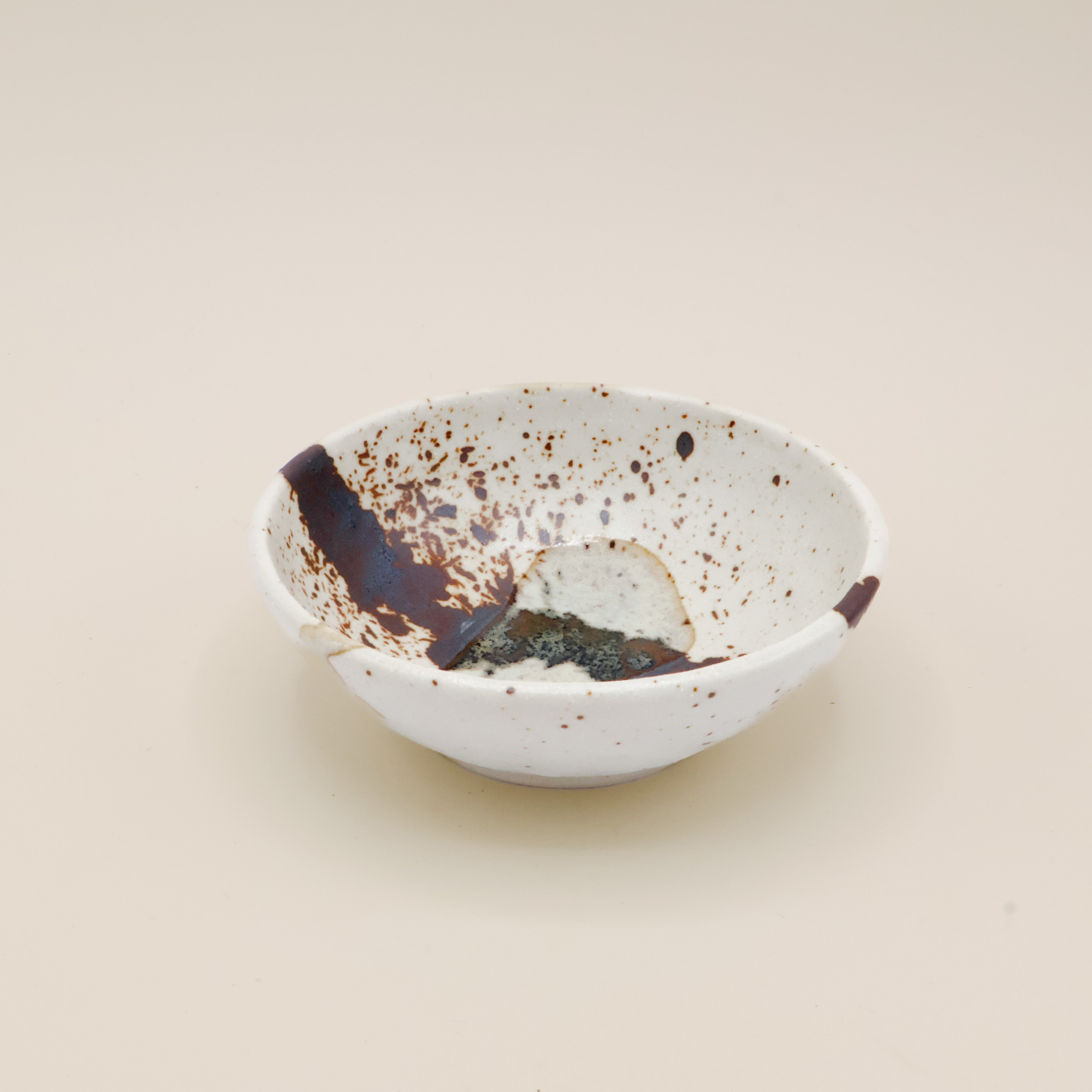 Bowl with brown splash and glaze stripe