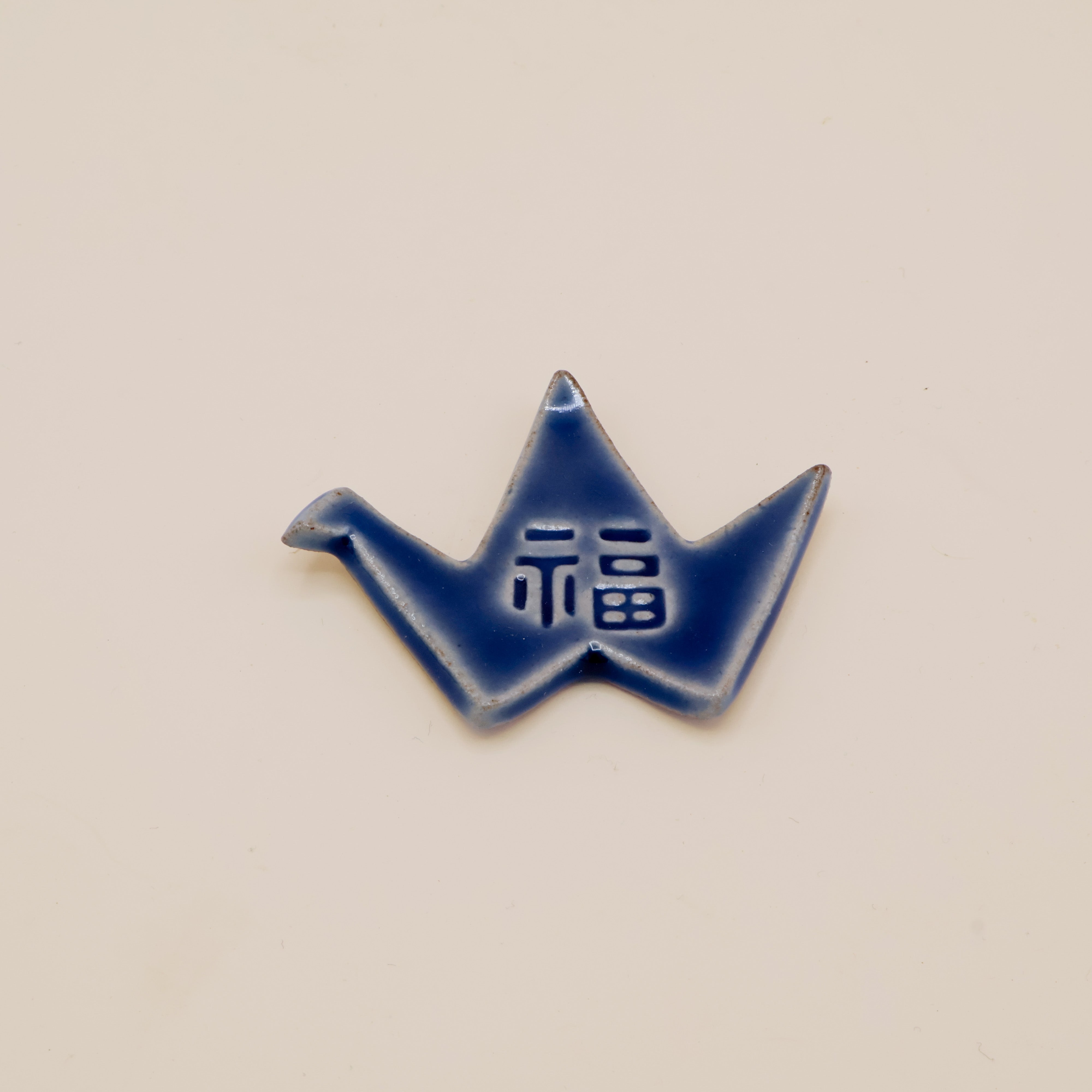 Spisepindeholder - Blå origami fugl med tegn