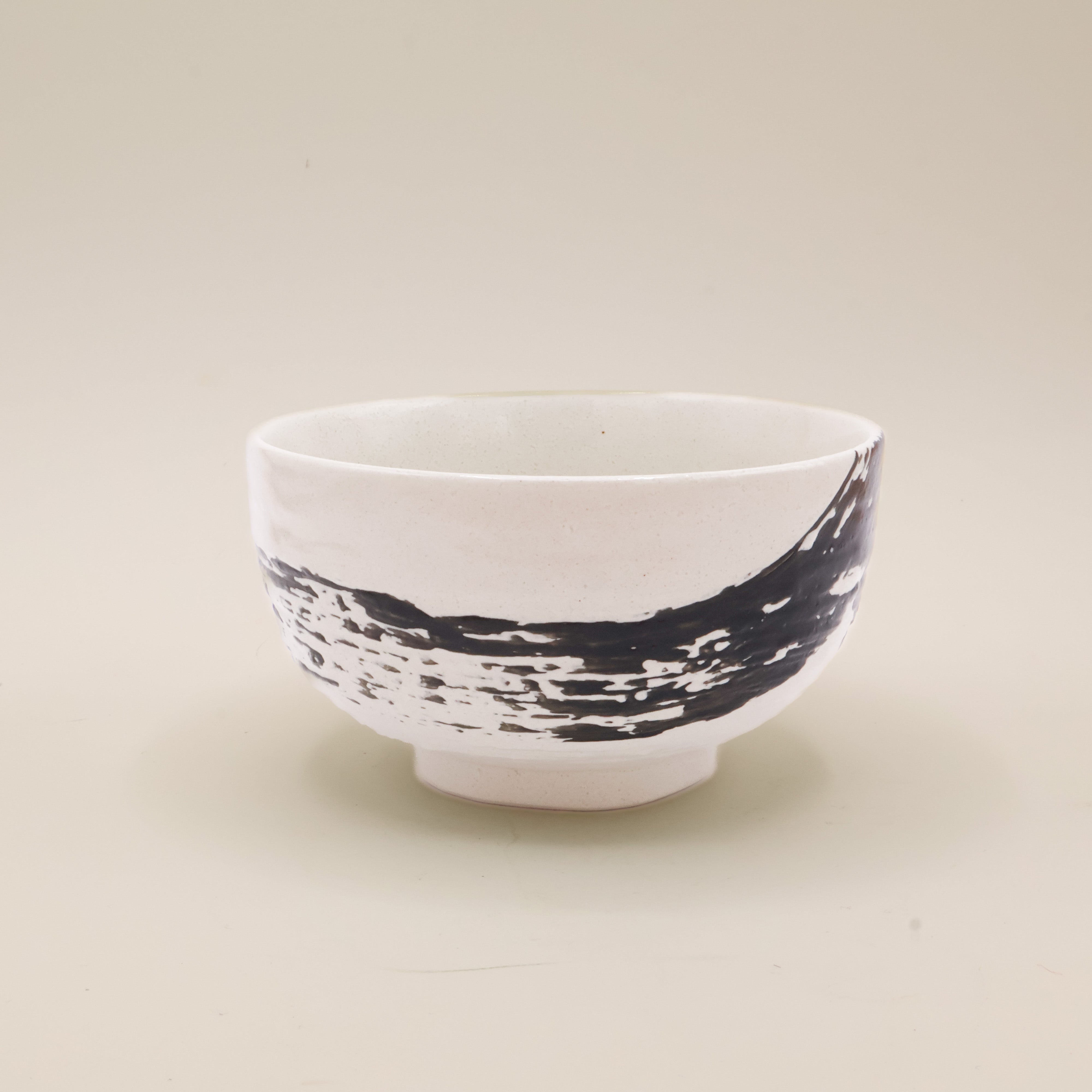 White bowl with black brushstroke