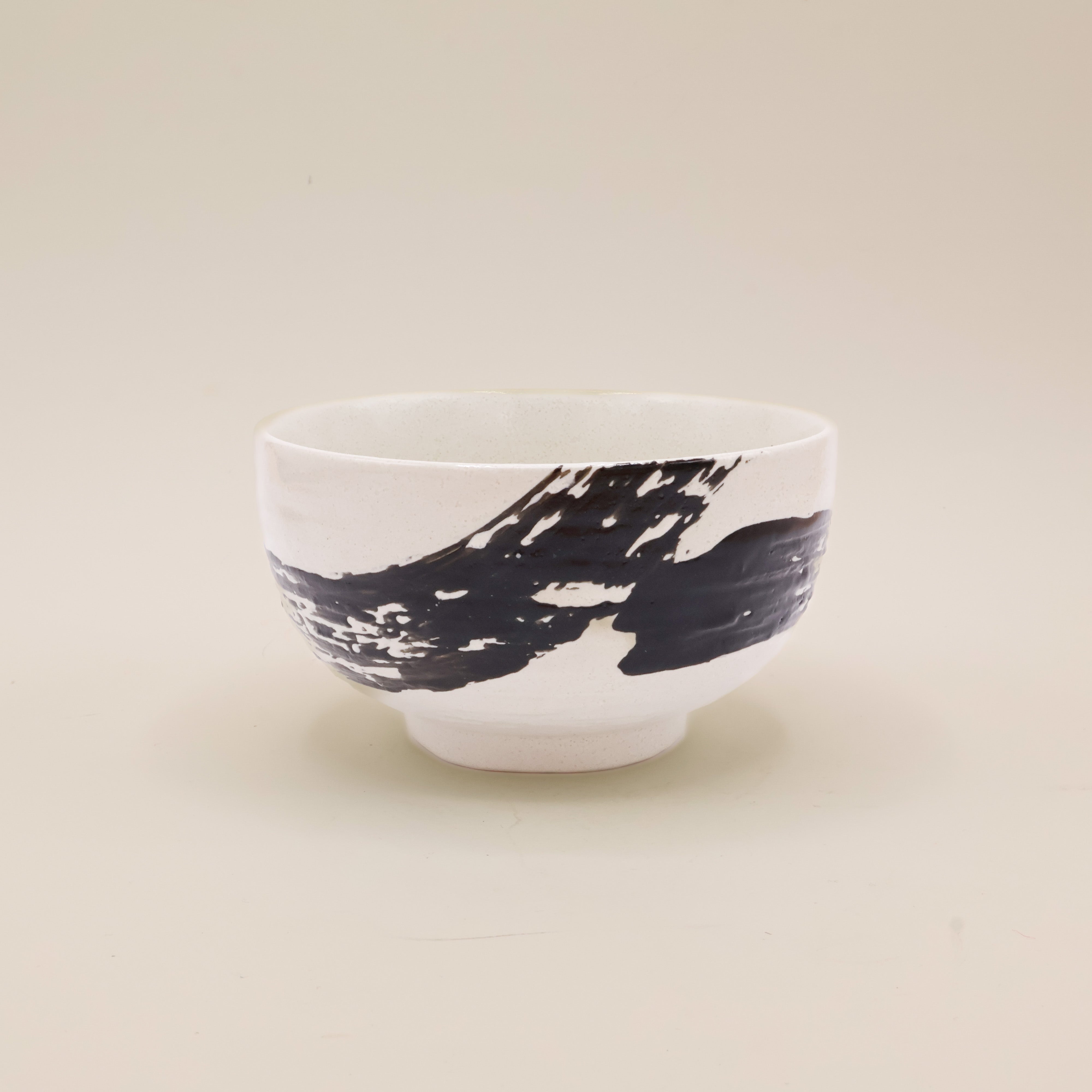 White bowl with black brushstroke