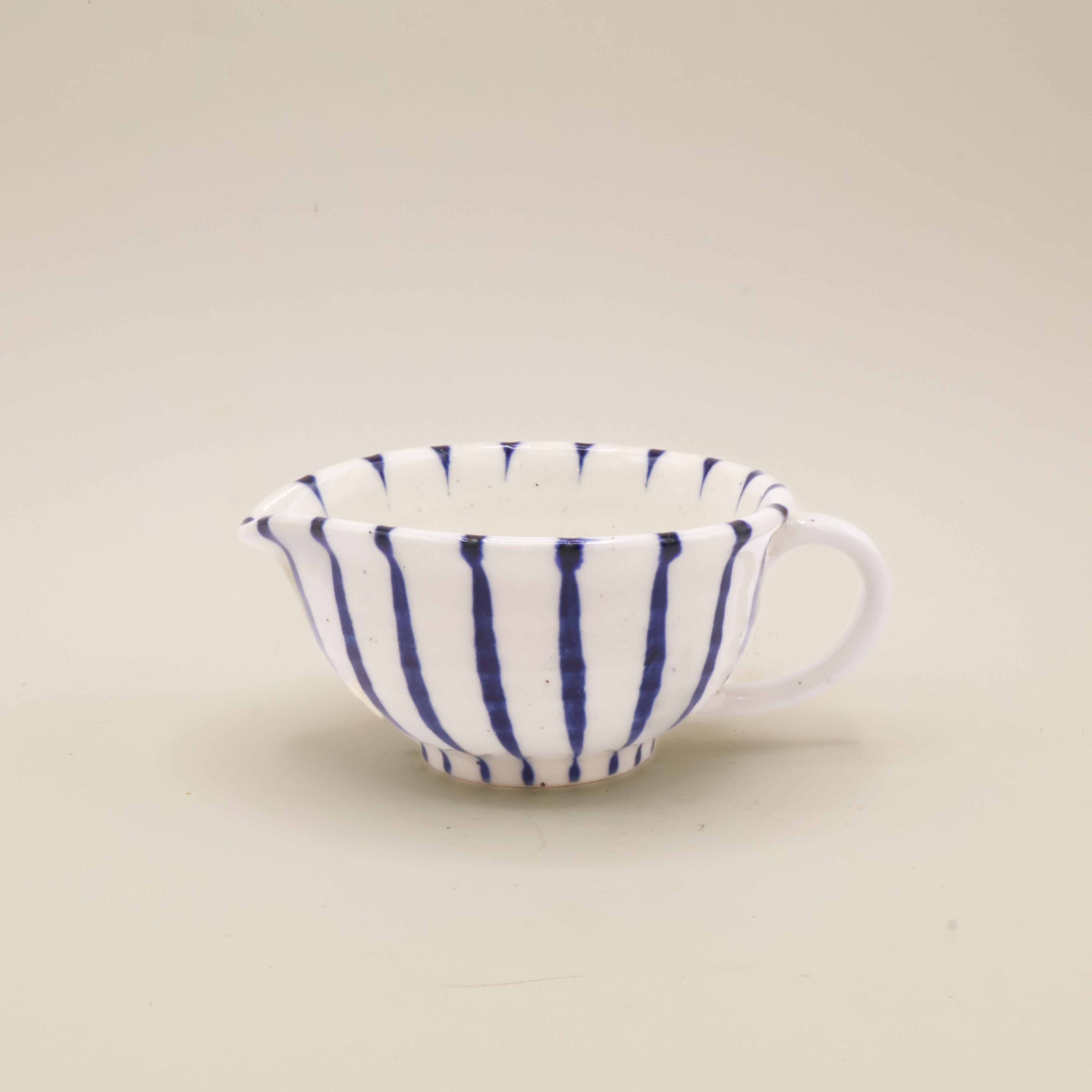 White milk jug with stripes