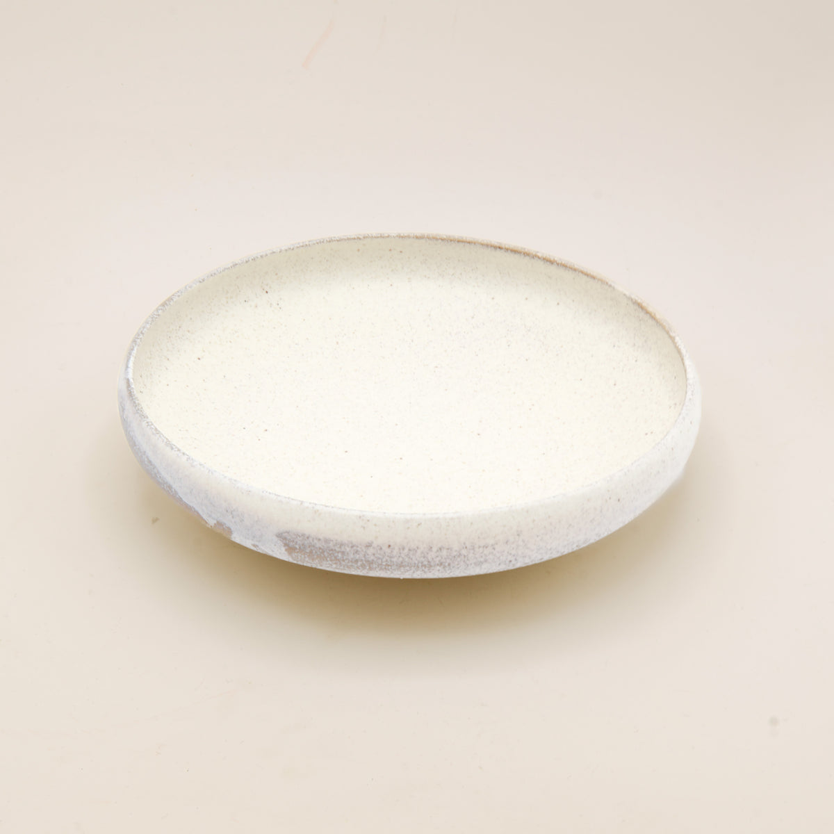 (Price) Rustic sand-colored dish with rounded edge