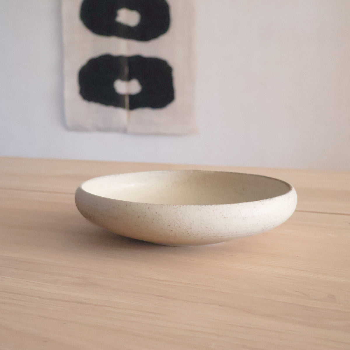 (Price) Rustic sand-colored dish with rounded edge