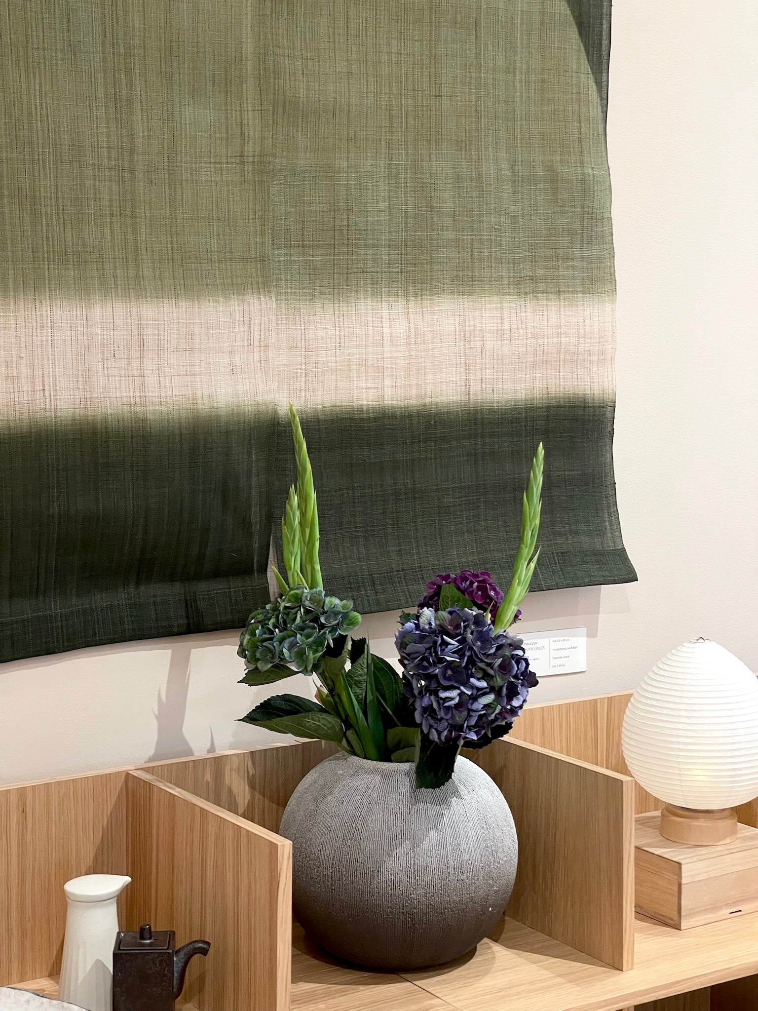 Tapestry with shades of green and half circle
