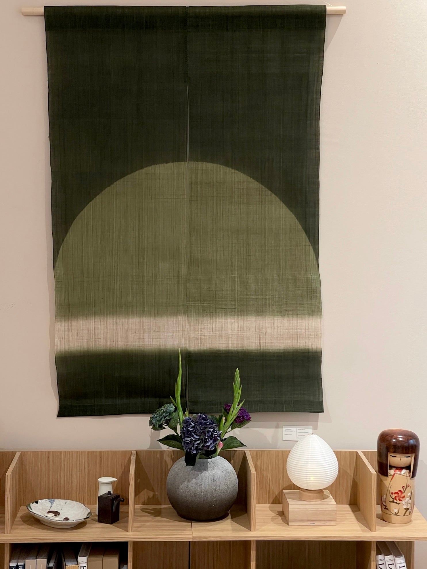 Tapestry with shades of green and half circle