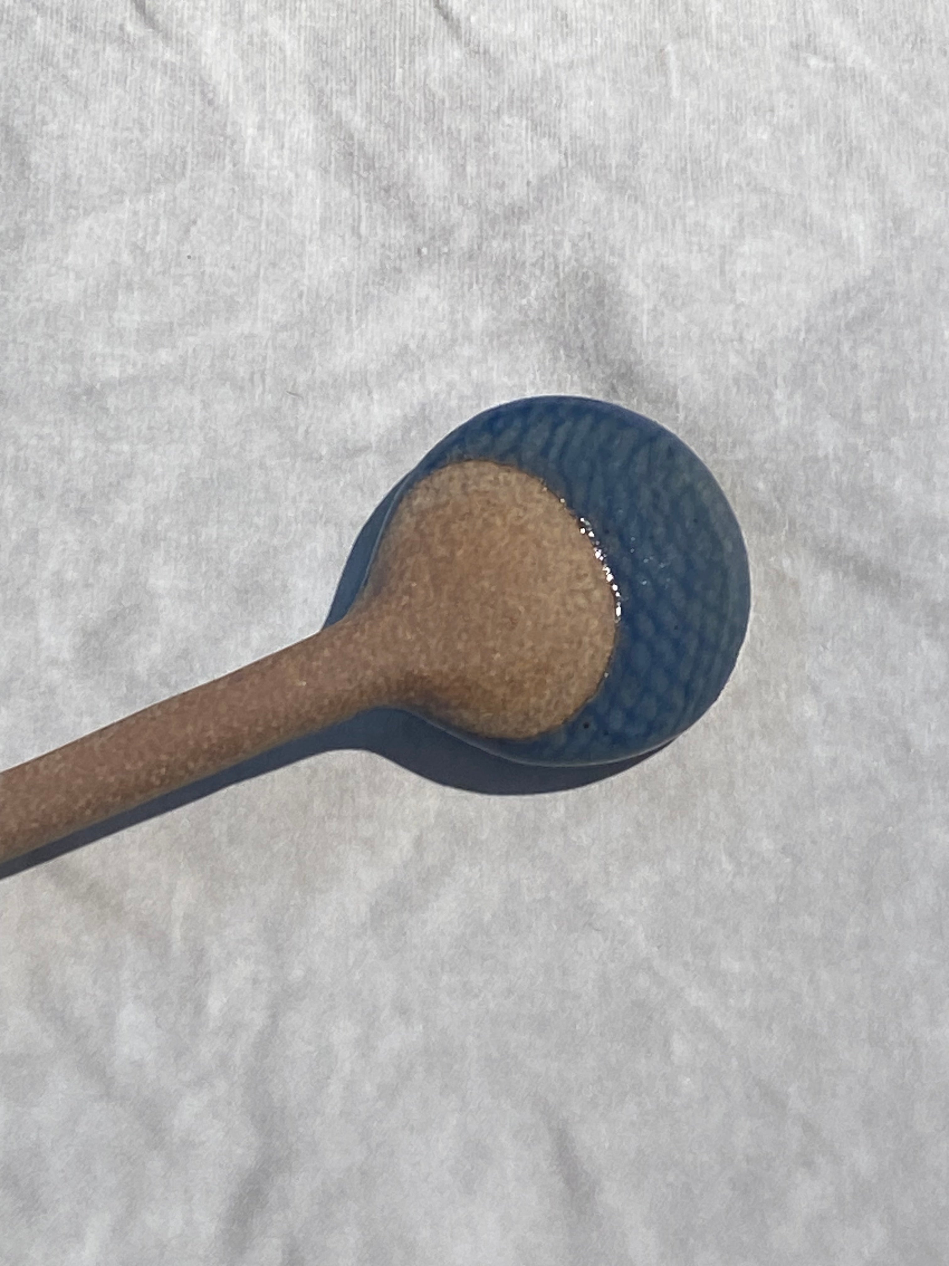 Ceramic spoon with blue glaze