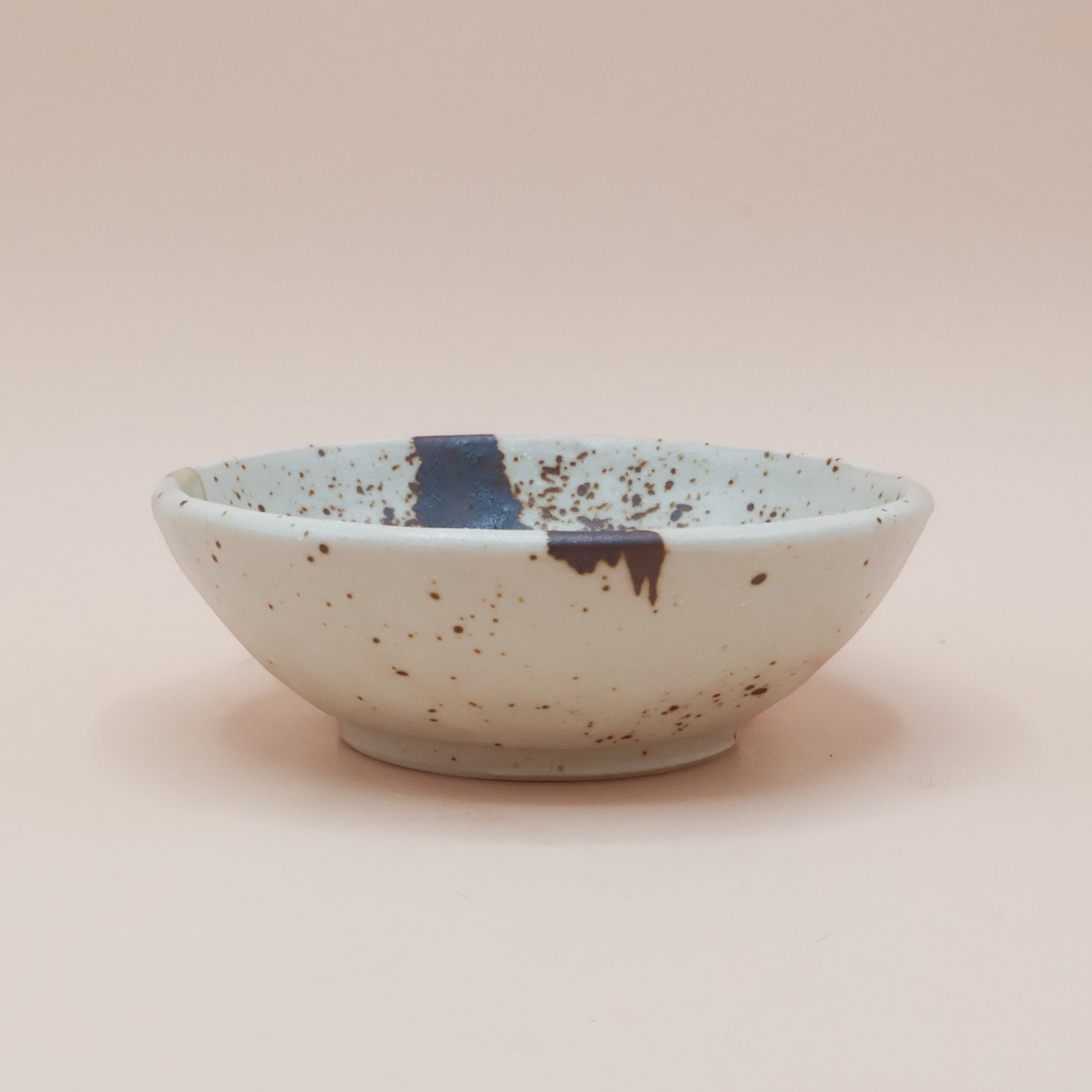 Bowl with brown splash and glaze stripe