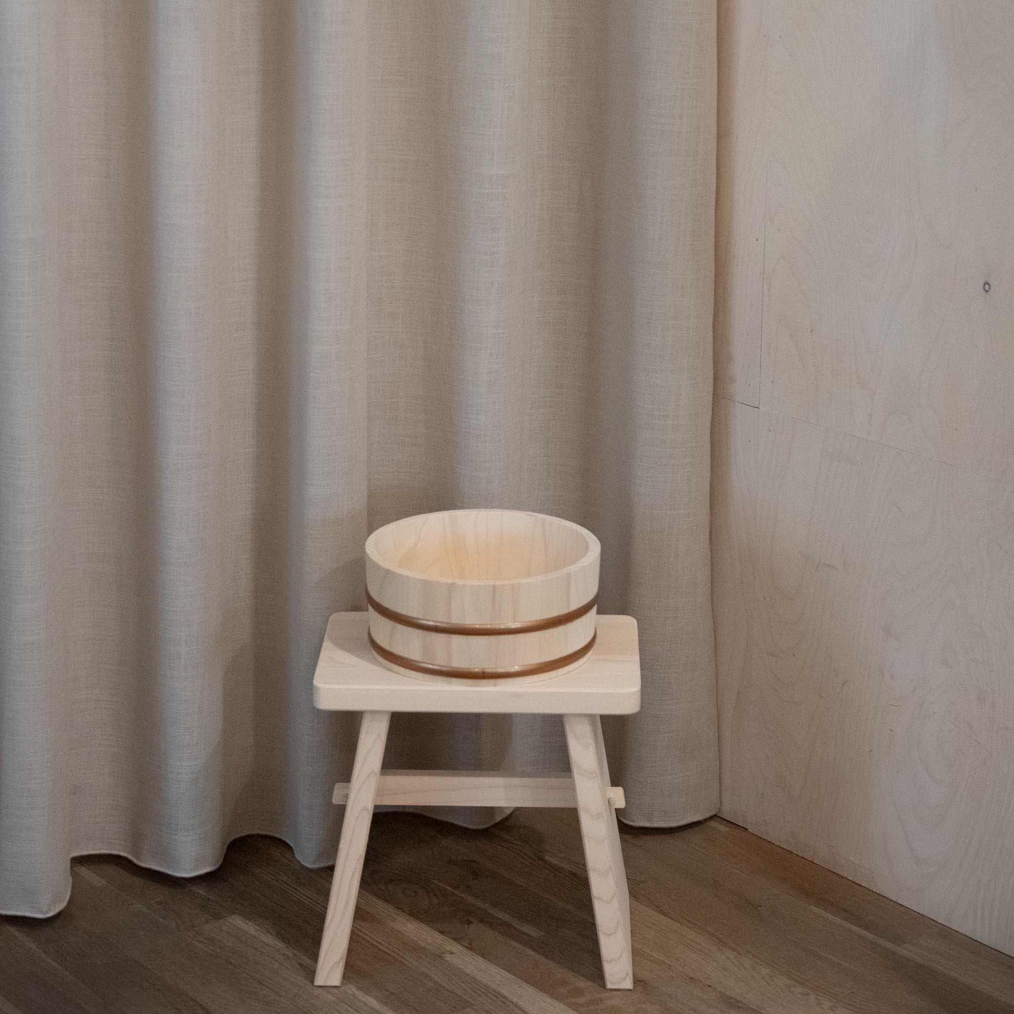 Large wooden tub with plastic straps