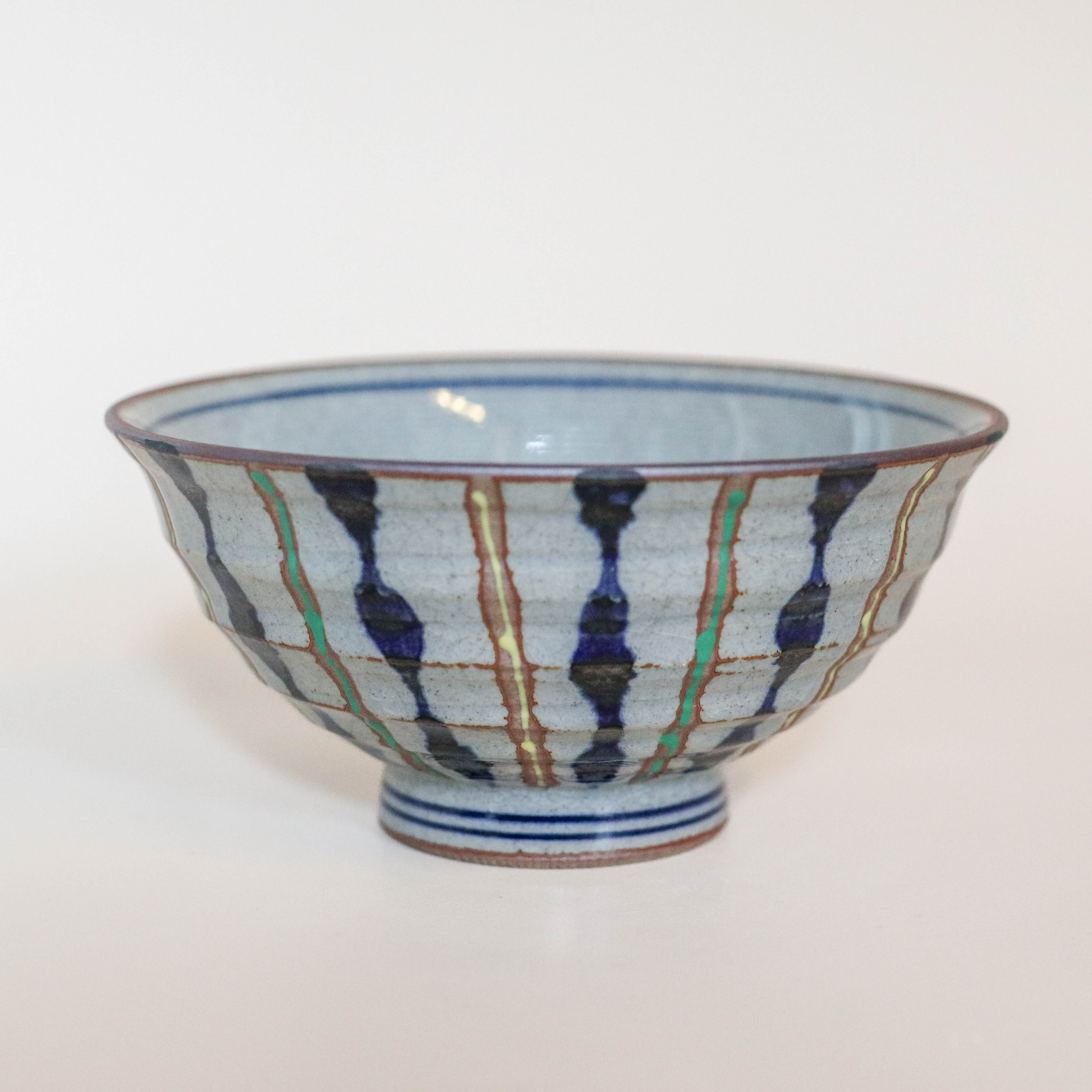 (Missing price, quantity) Gray bowl with blue, yellow and green stripes