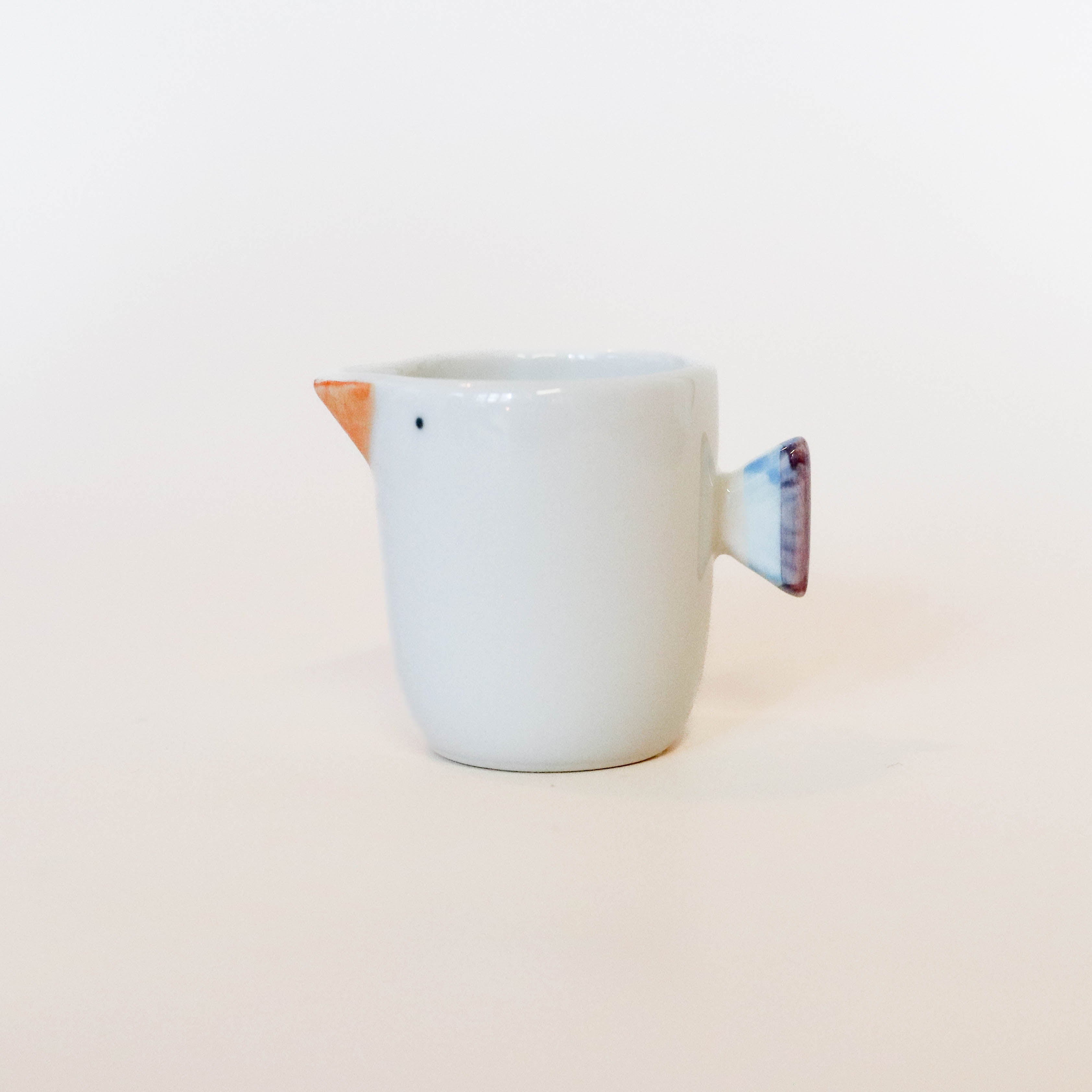 (Missing price and quantity) Milk jug with bird motif