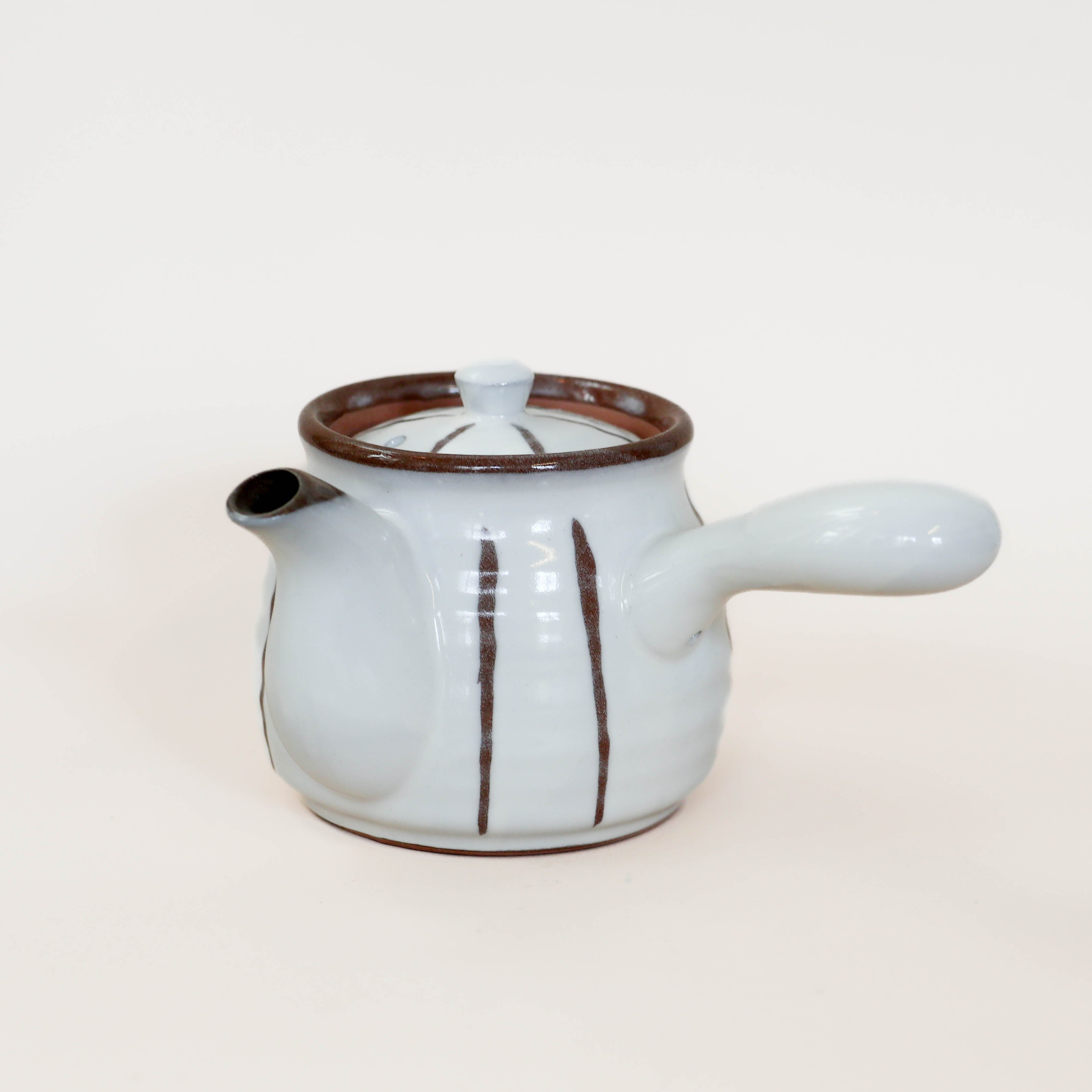 (Missing price and quantity) White teapot with brown details and handle