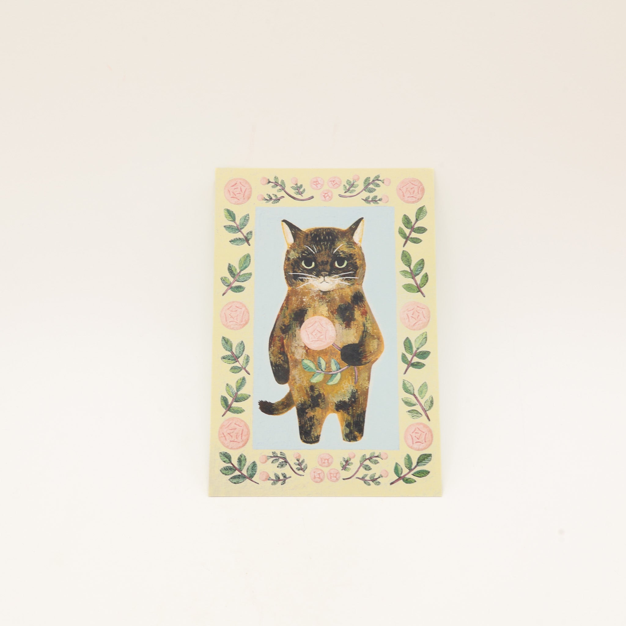 Japansk kort med kat der holder en rose