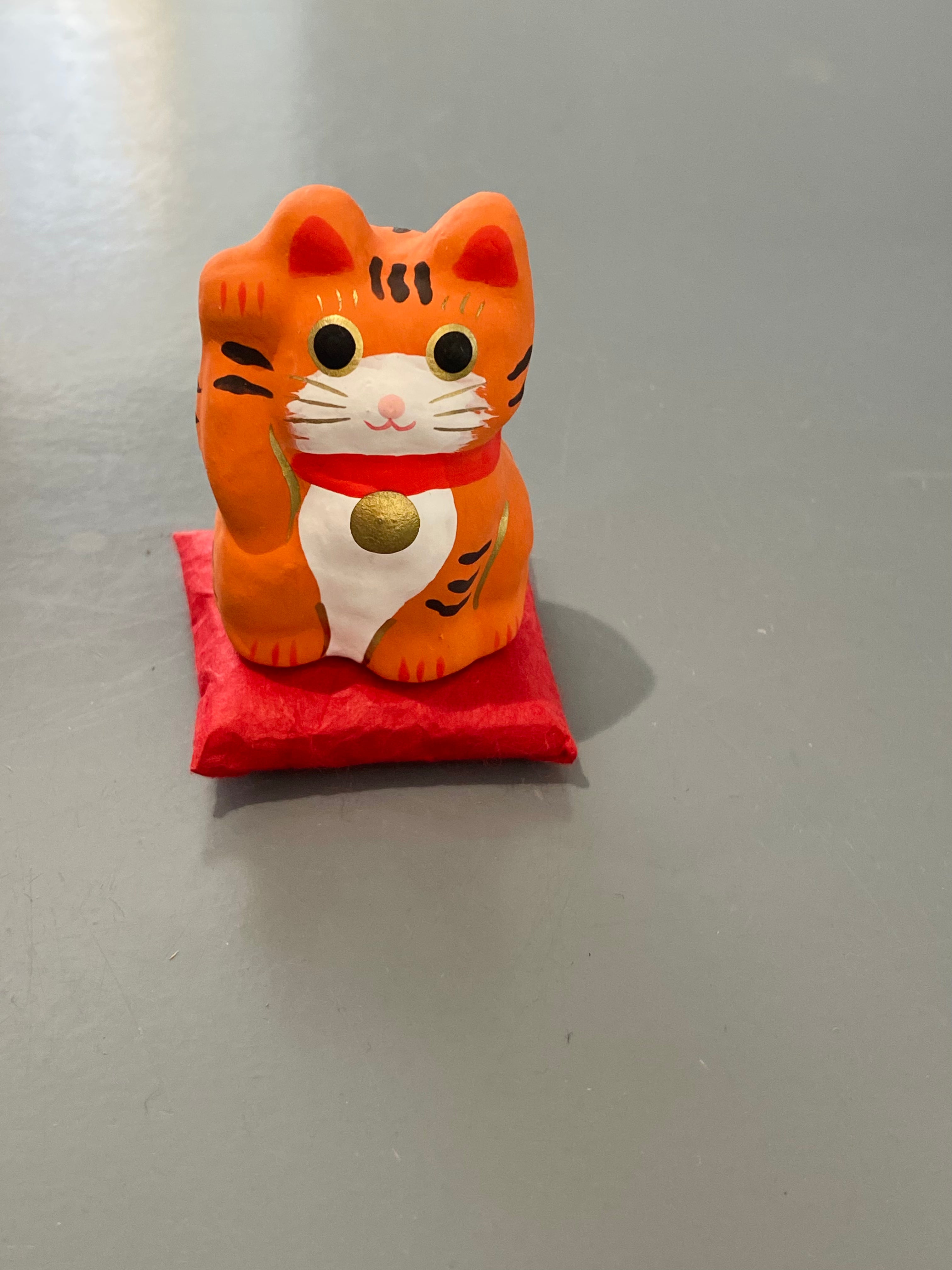 Lucky Cat on pillow, orange