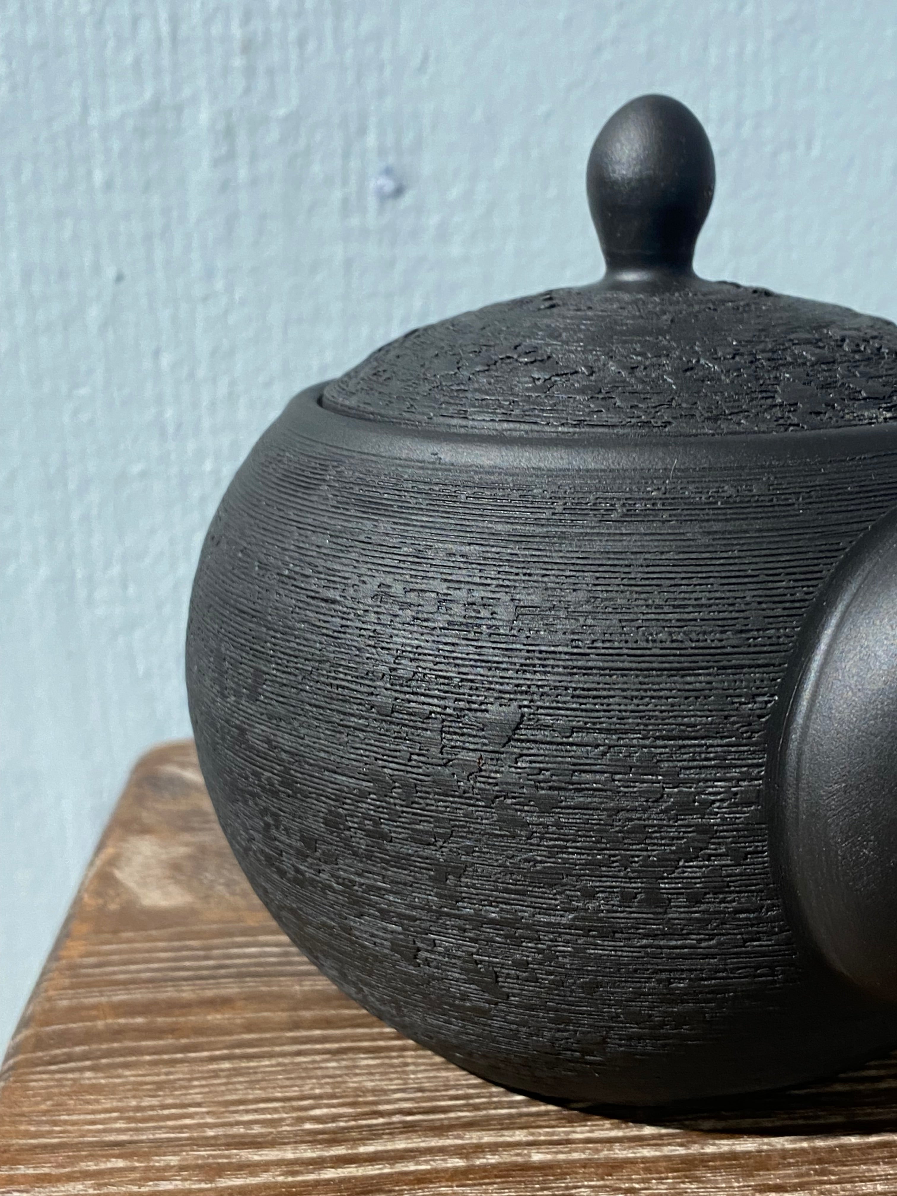 Rustic black teapot with handle