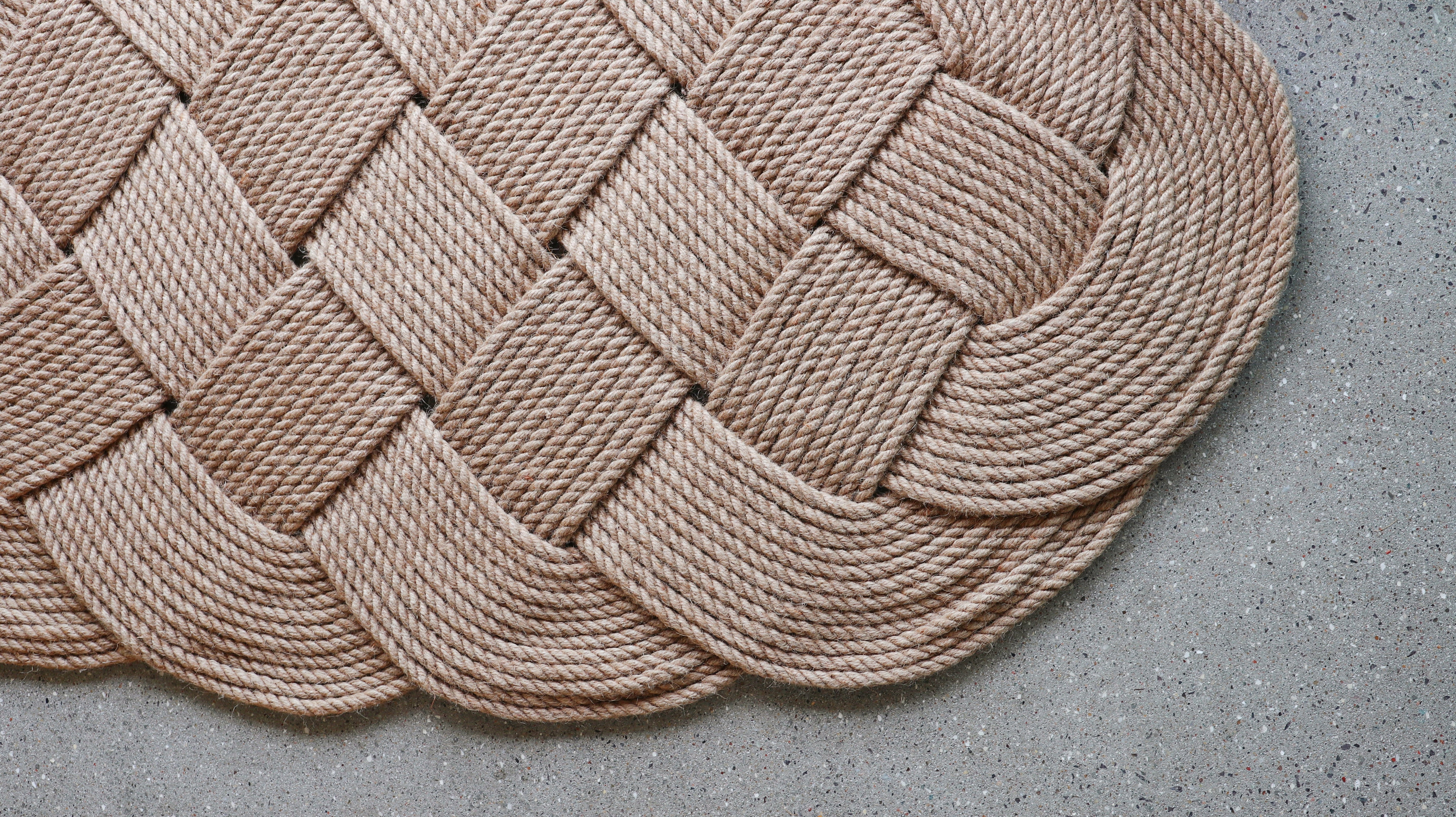 Large hand-woven door mat in jute