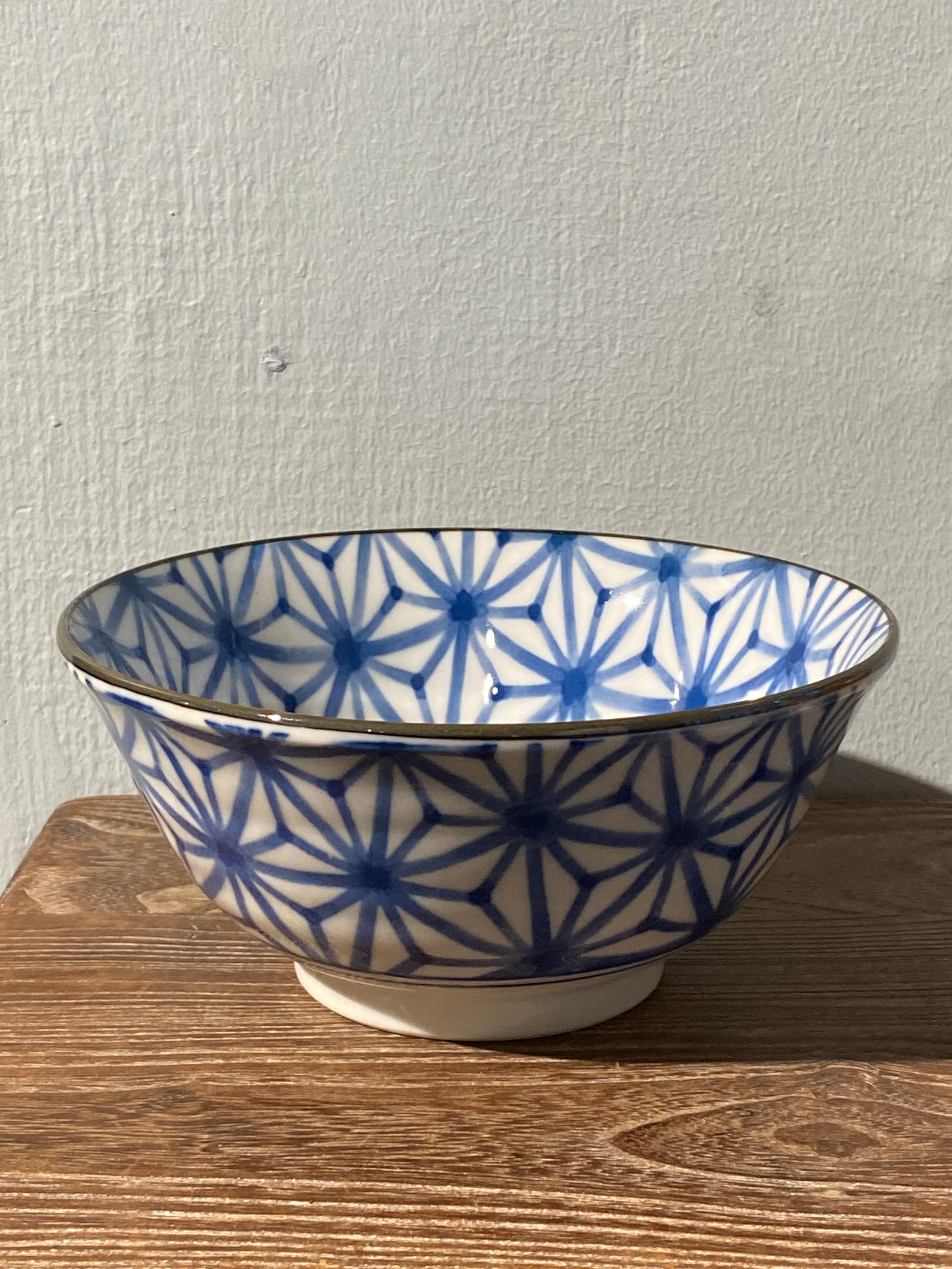 Bowl with blue pattern and brown rim