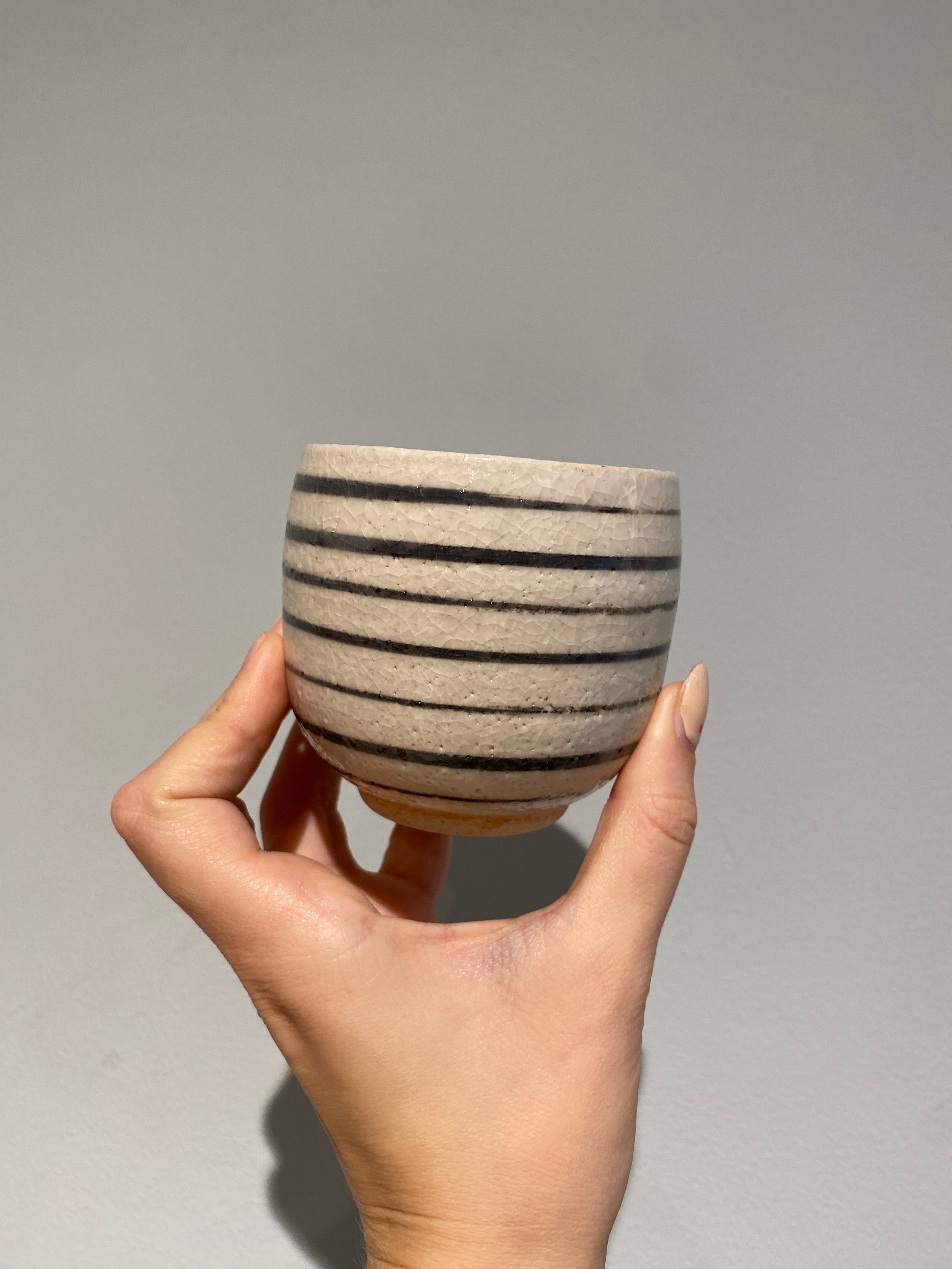 Small cup with horizontal stripes