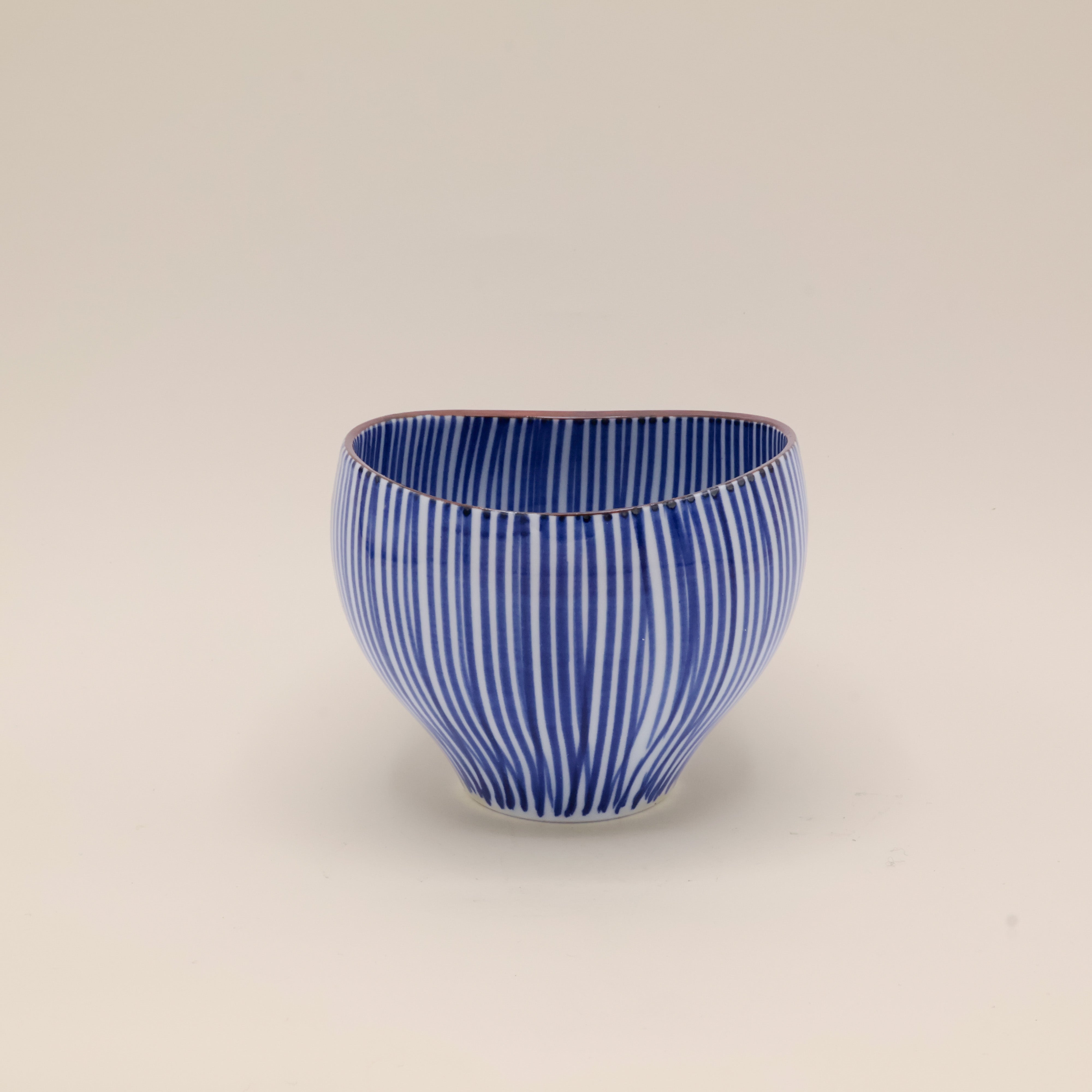 Cup with blue vertical stripes and brown rim