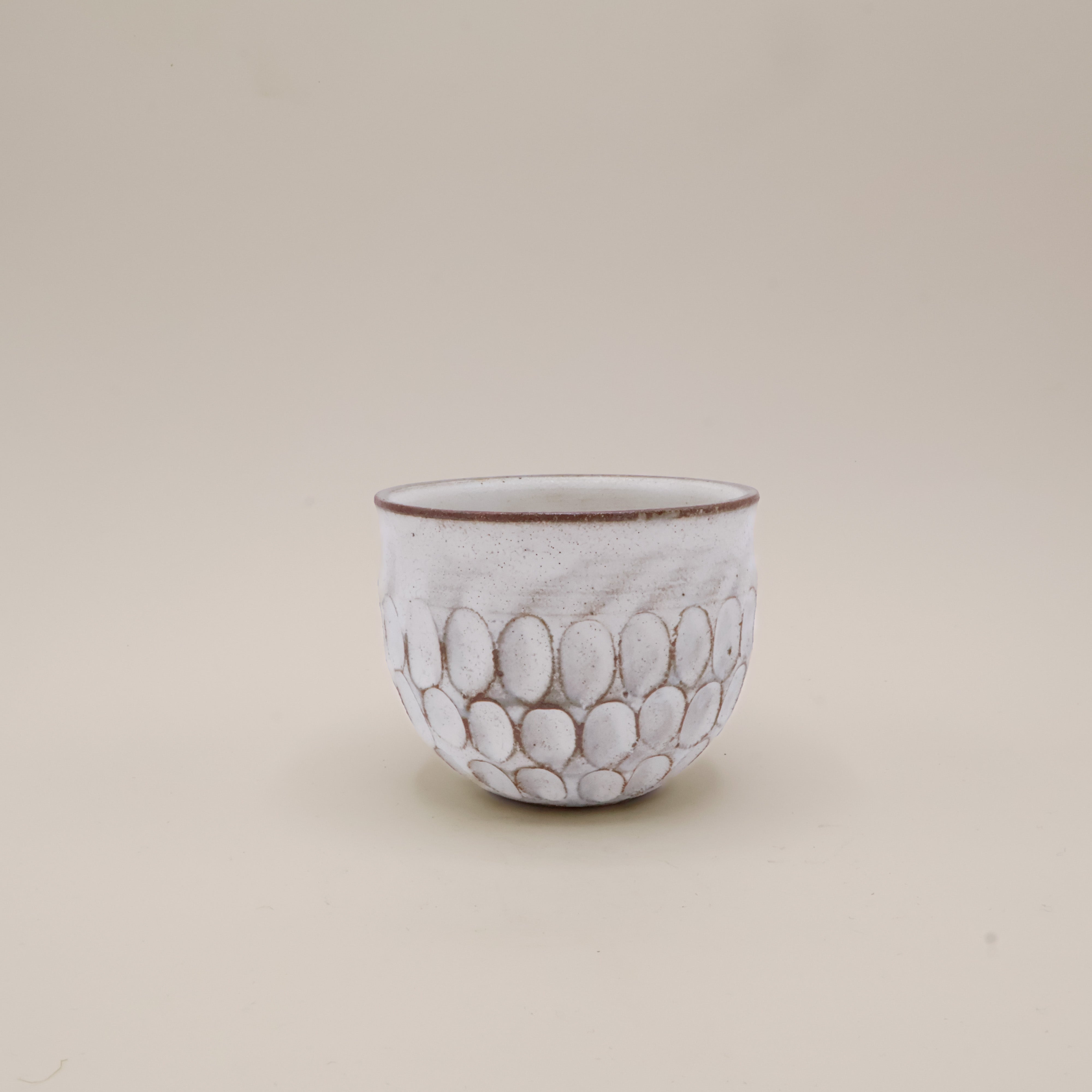 White cup with texture