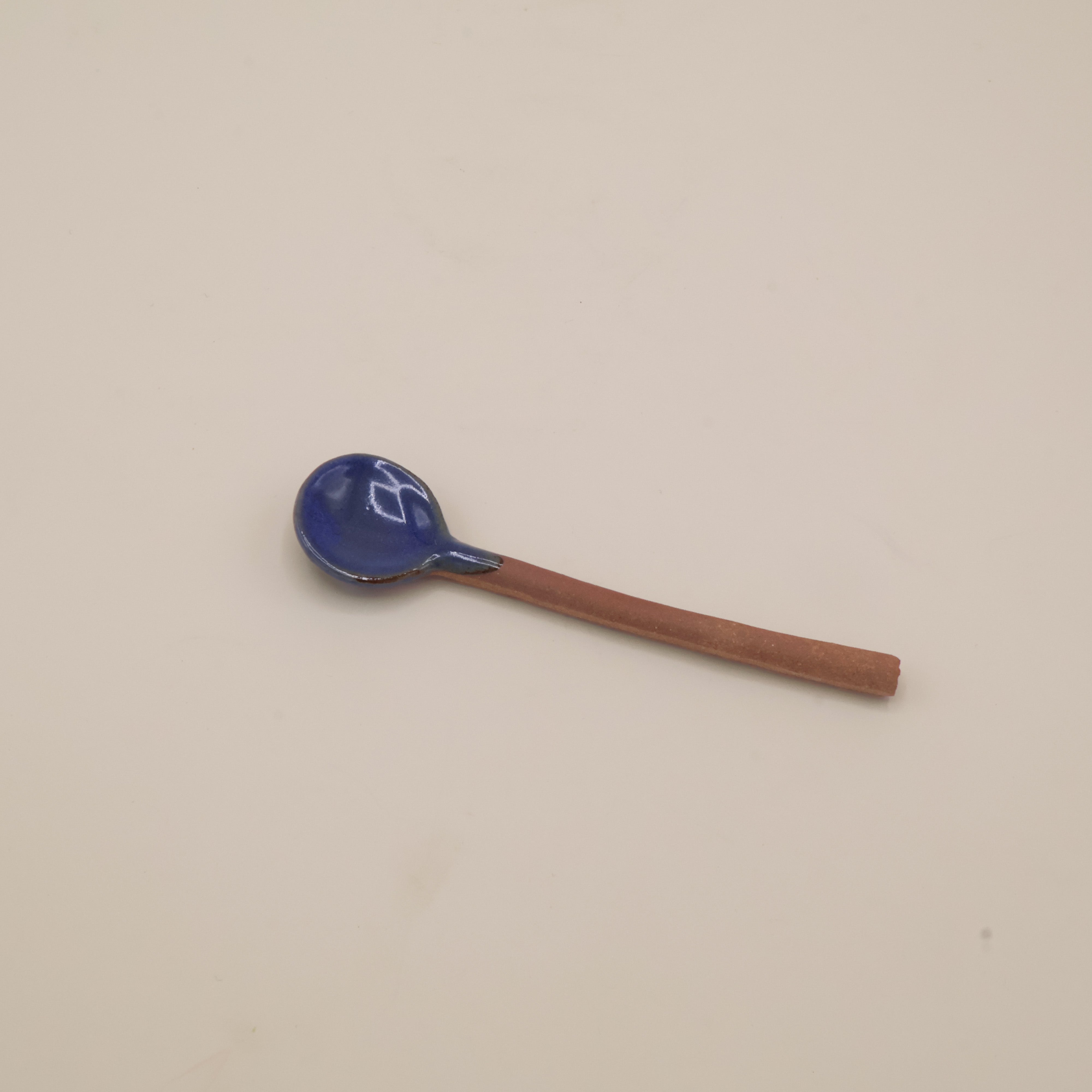 Ceramic spoon with blue glaze