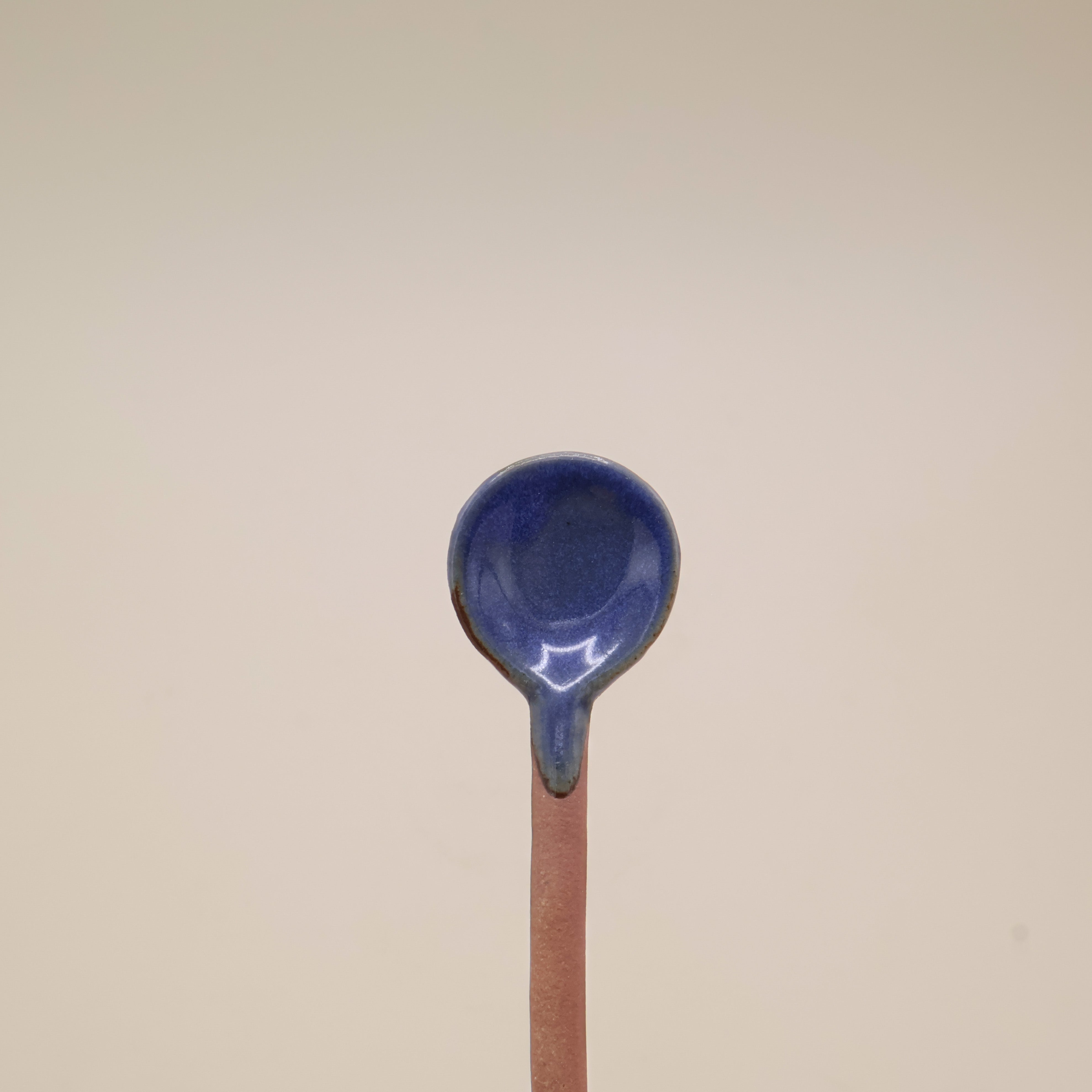 Ceramic spoon with blue glaze