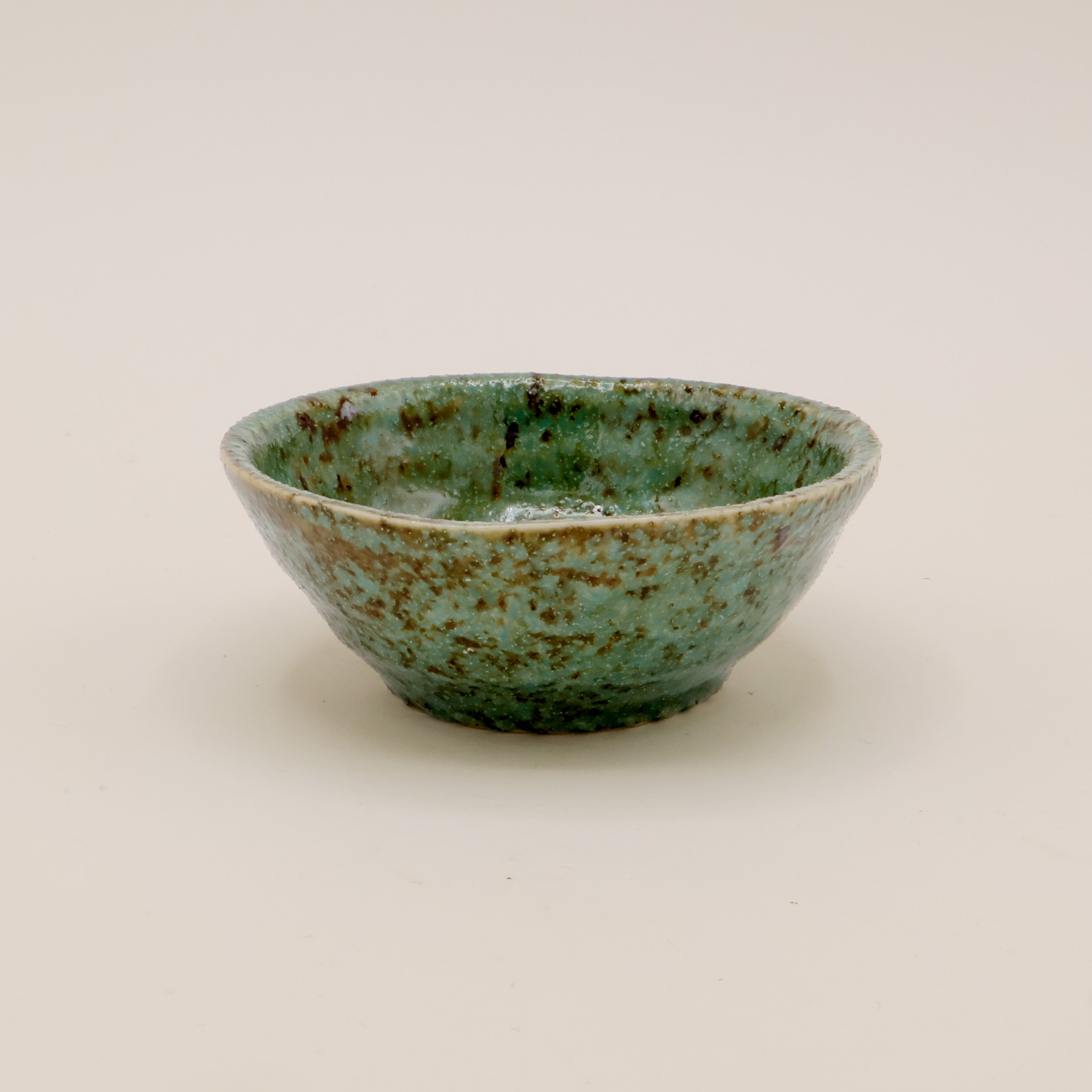 Small bowl with green and brown glaze
