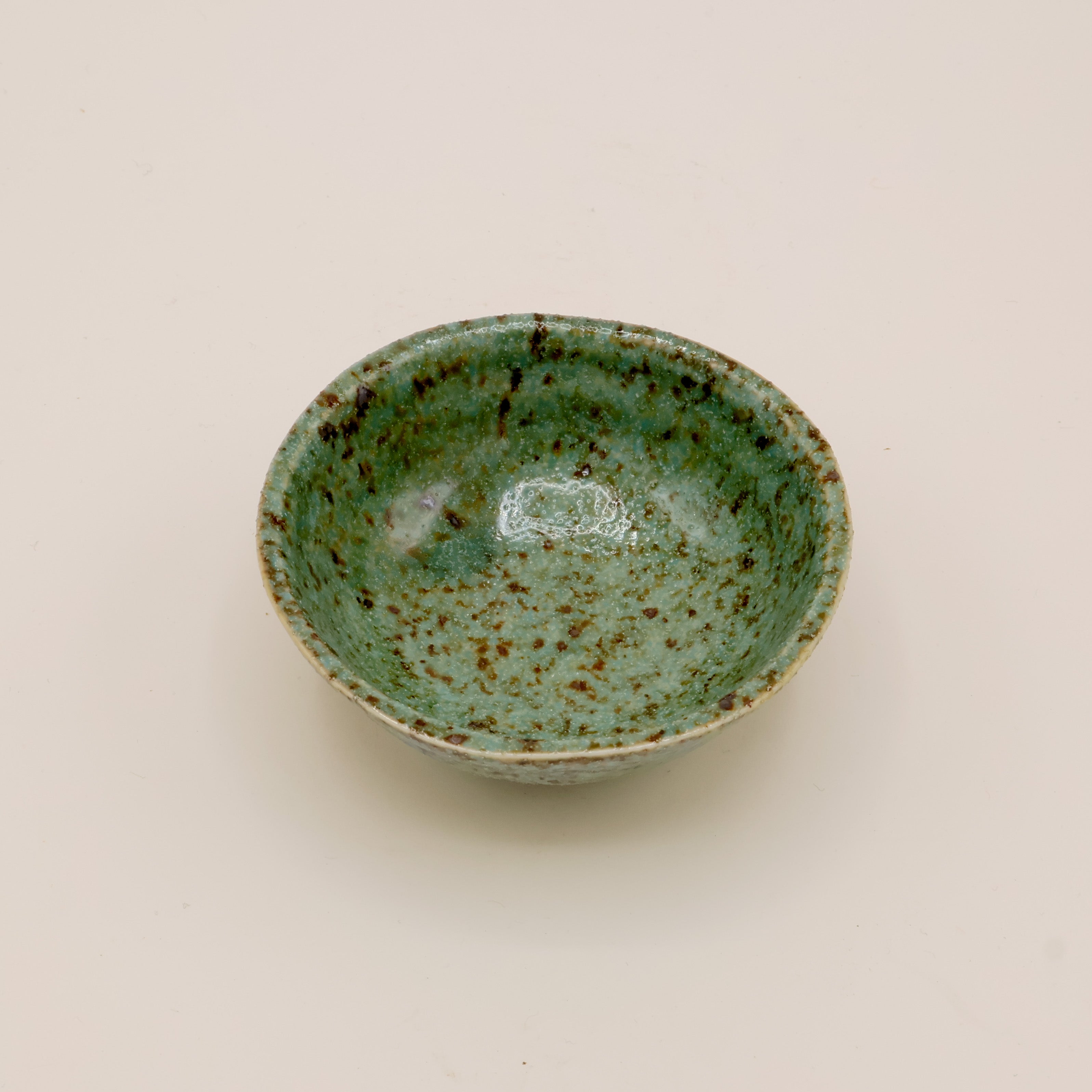 Small bowl with green and brown glaze