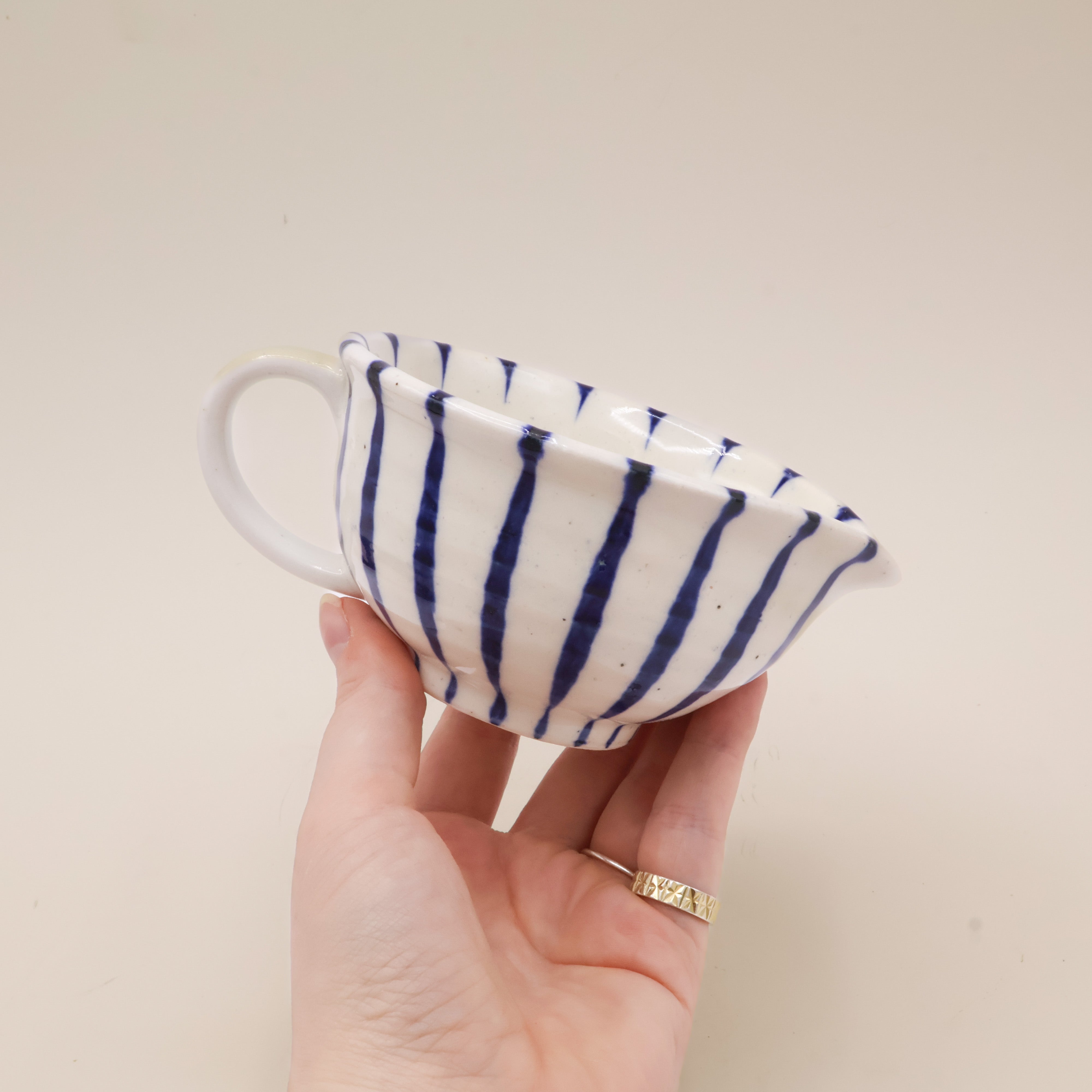 White milk jug with stripes