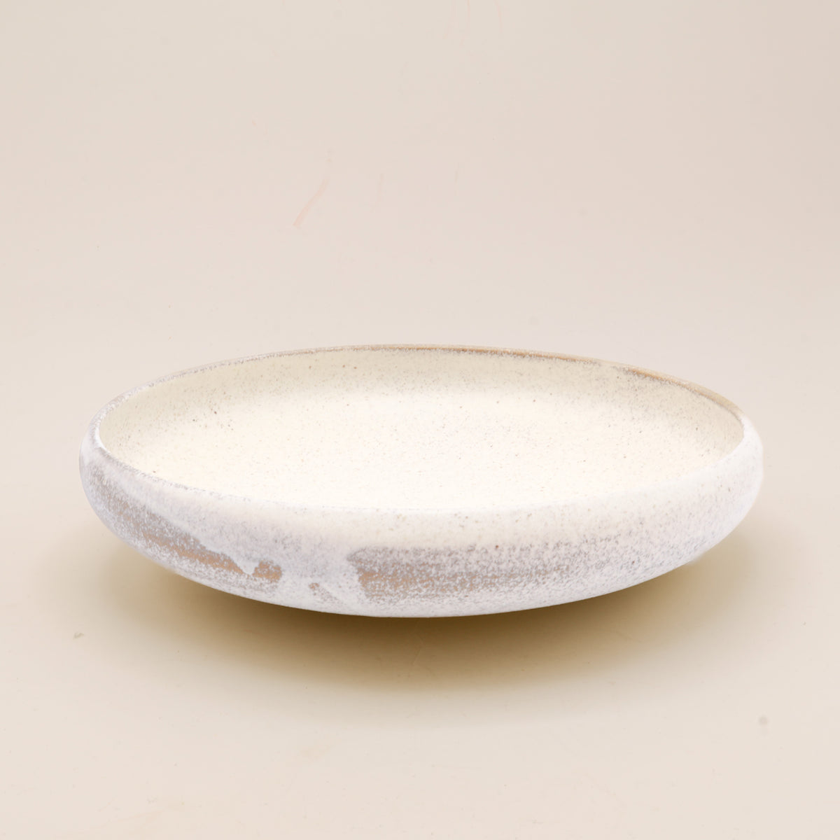 (Price) Rustic sand-colored dish with rounded edge