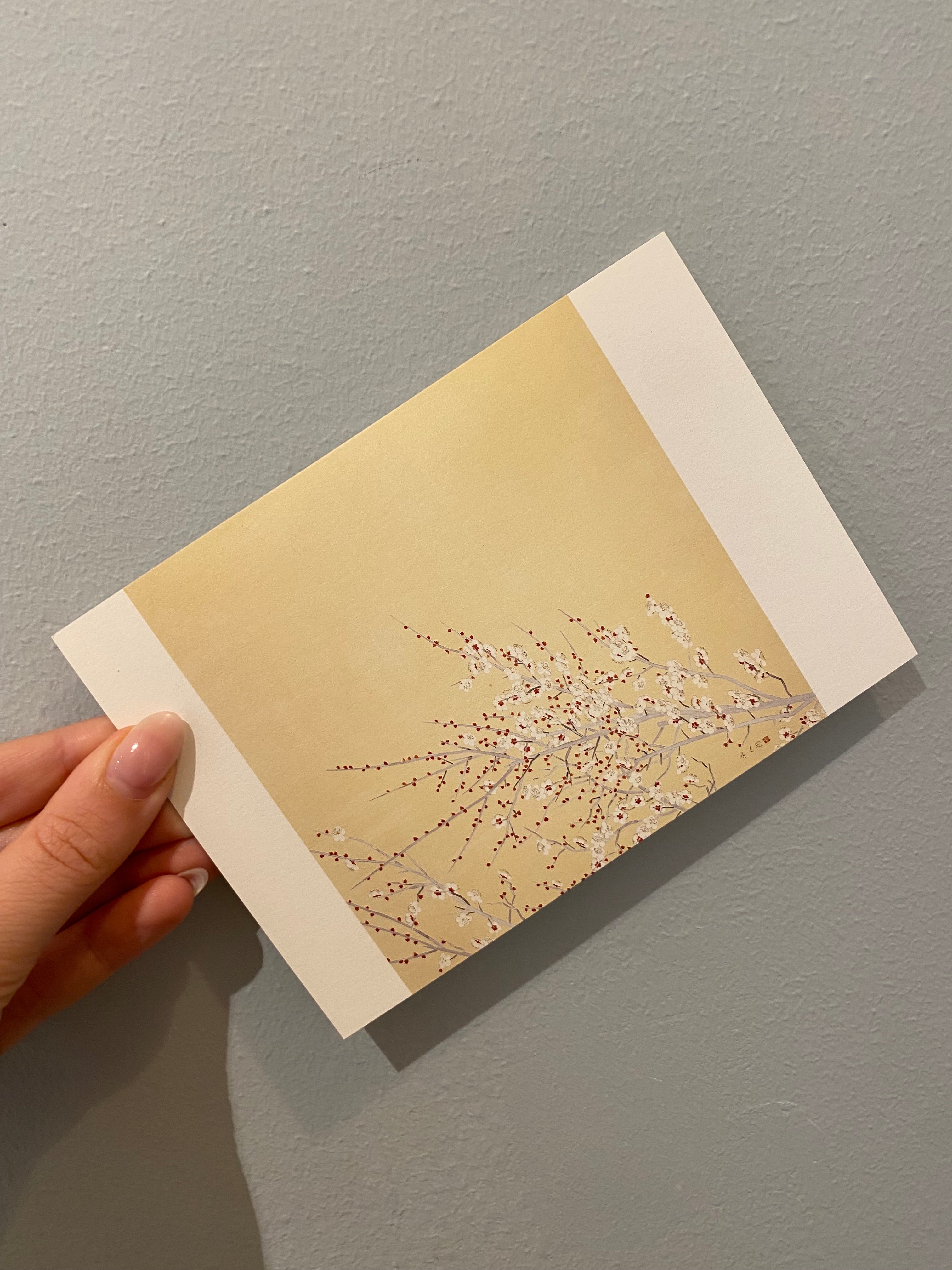Card with beige background and flower branches
