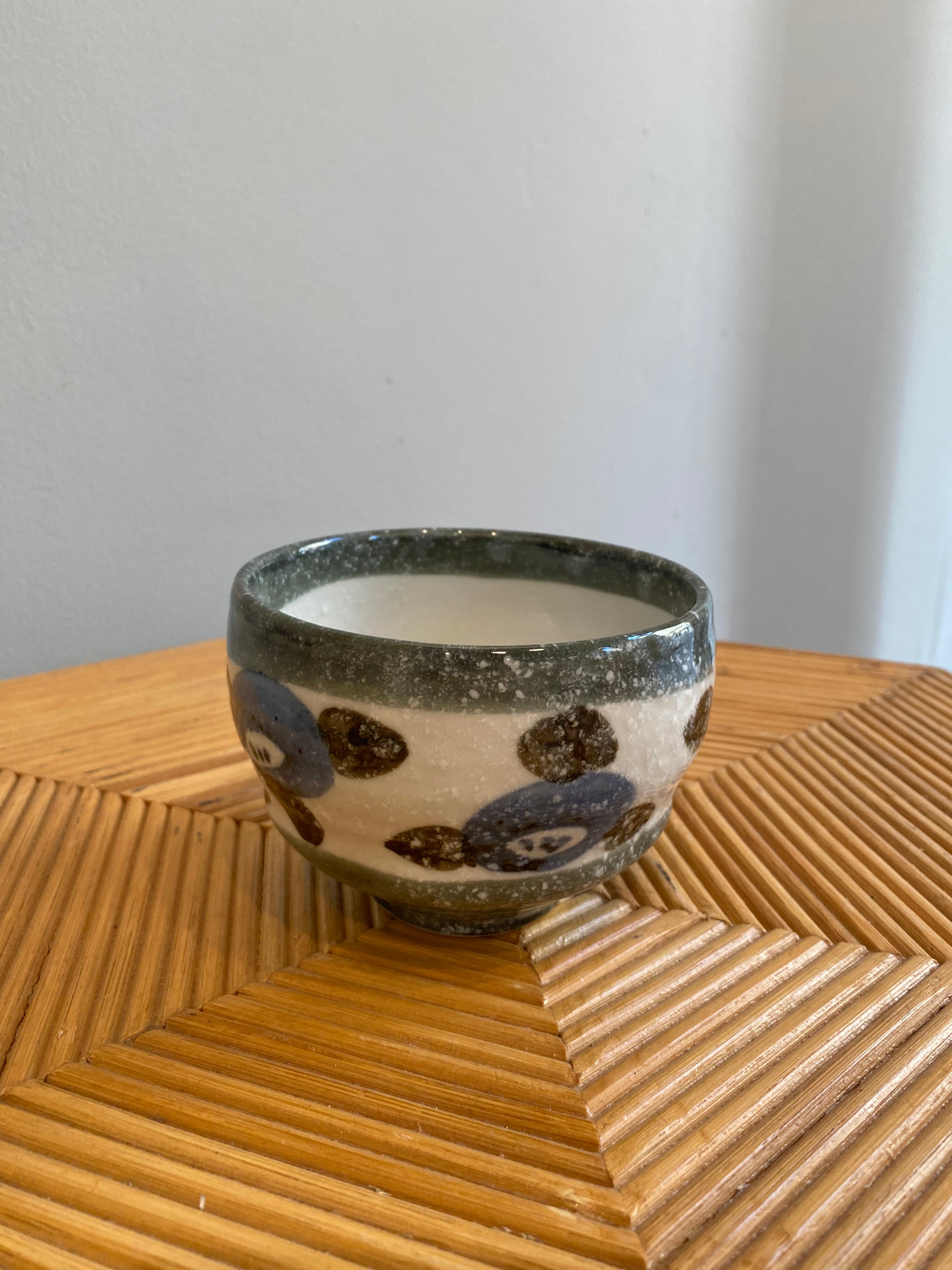 Japanese cup with flowers in blue, brown and gray details