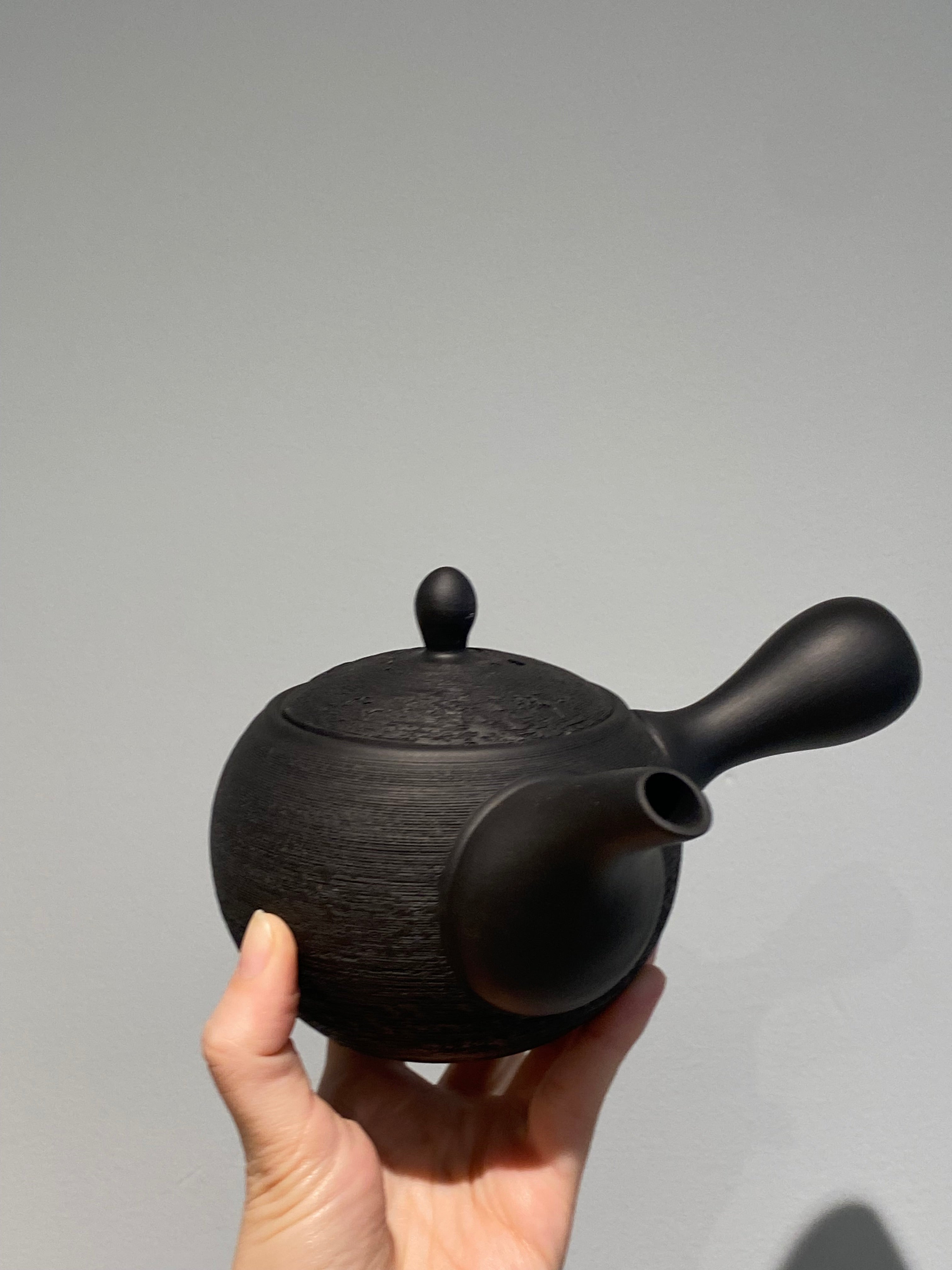 Rustic black teapot with handle