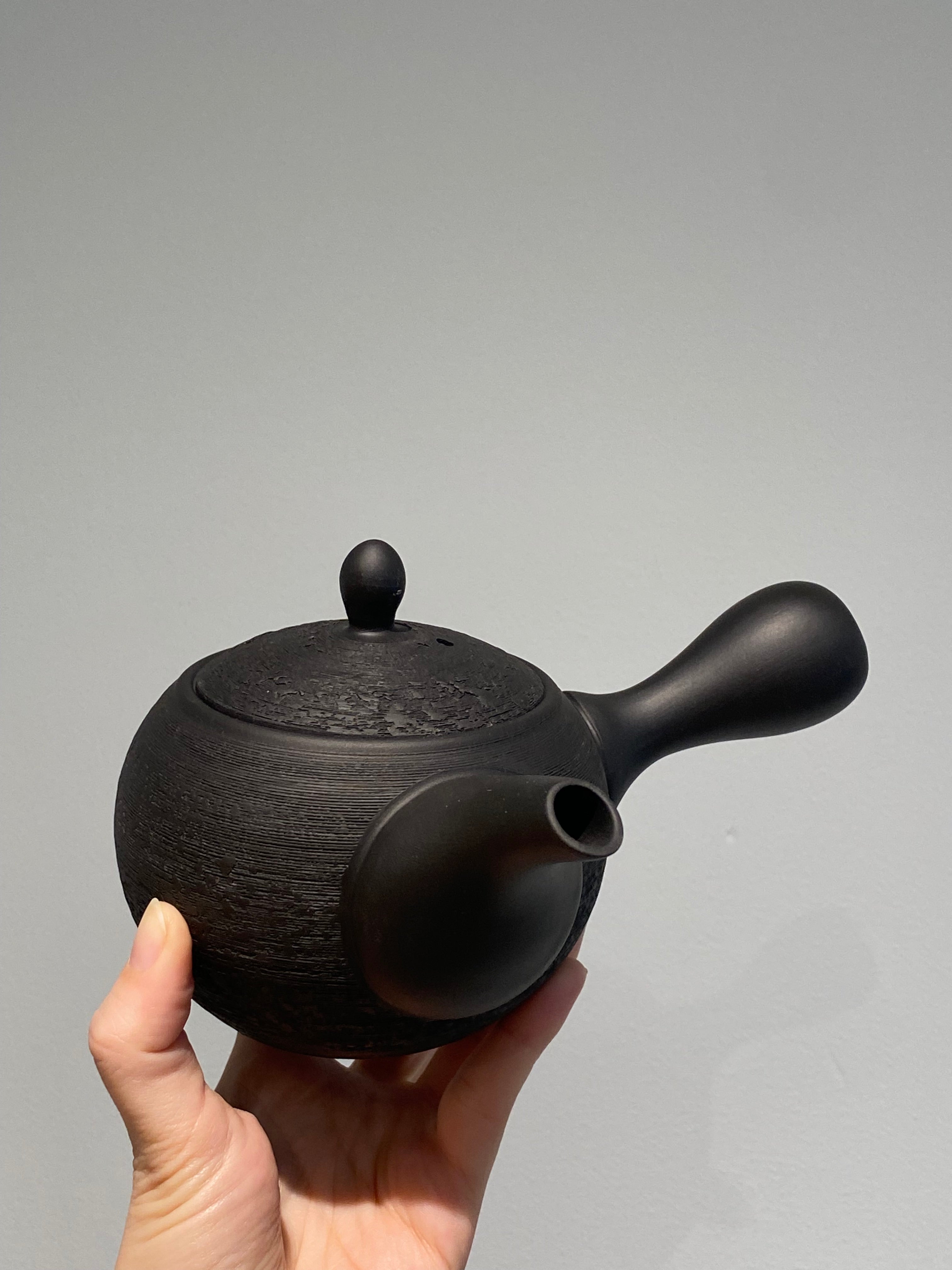 Rustic black teapot with handle