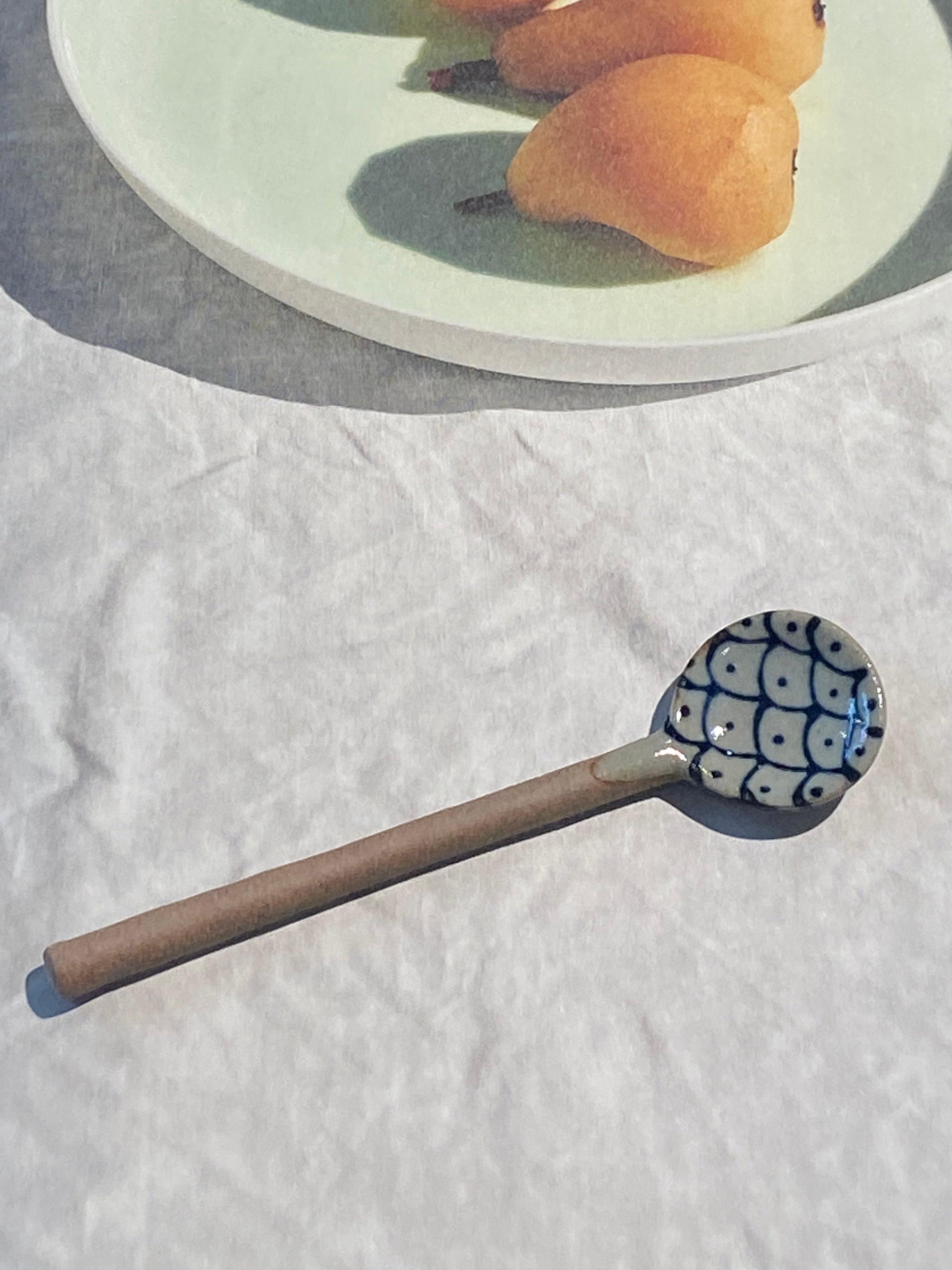 Ceramic spoon with motif of blue fish scales