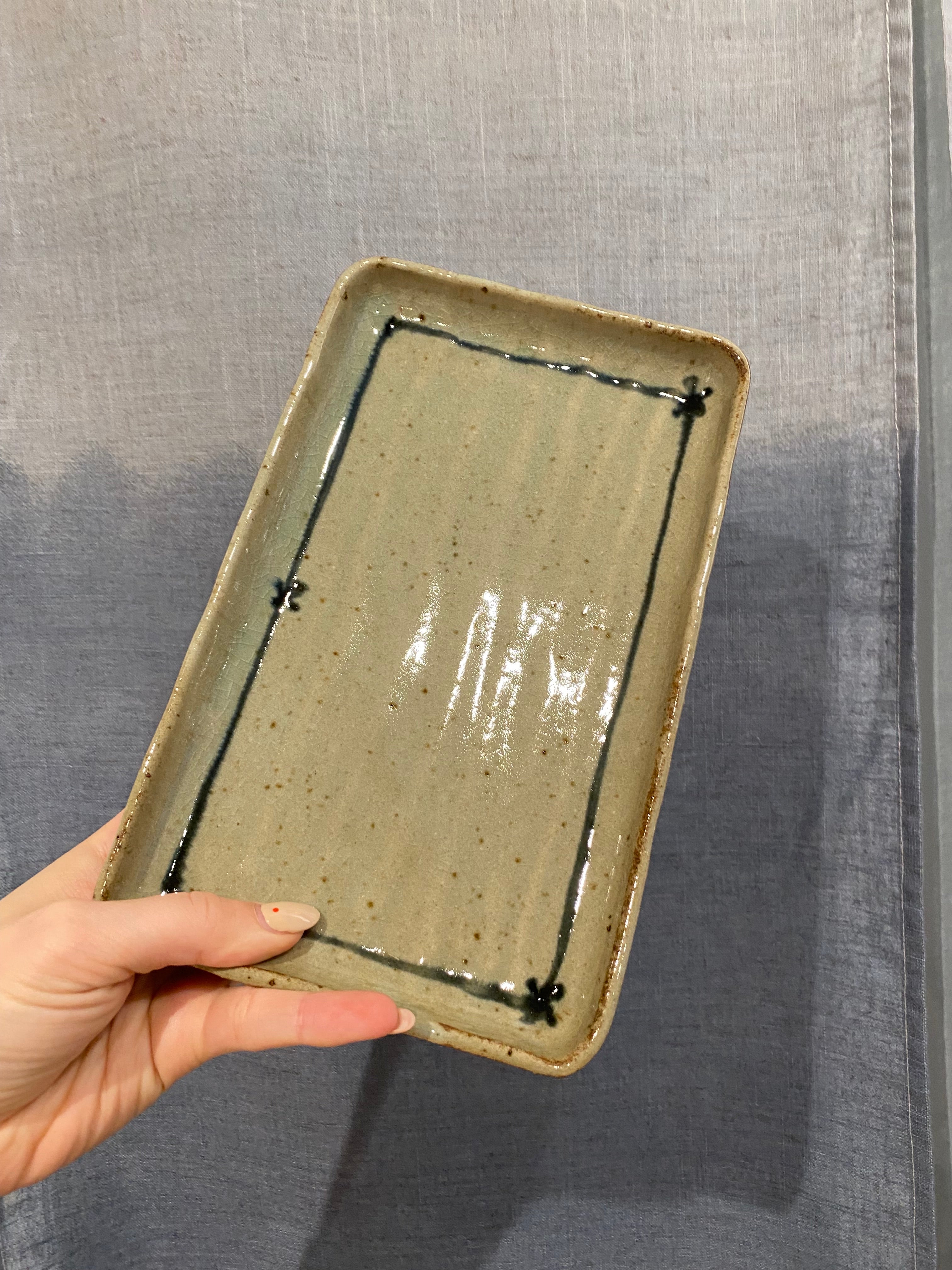 Square dish with green glaze and pattern details