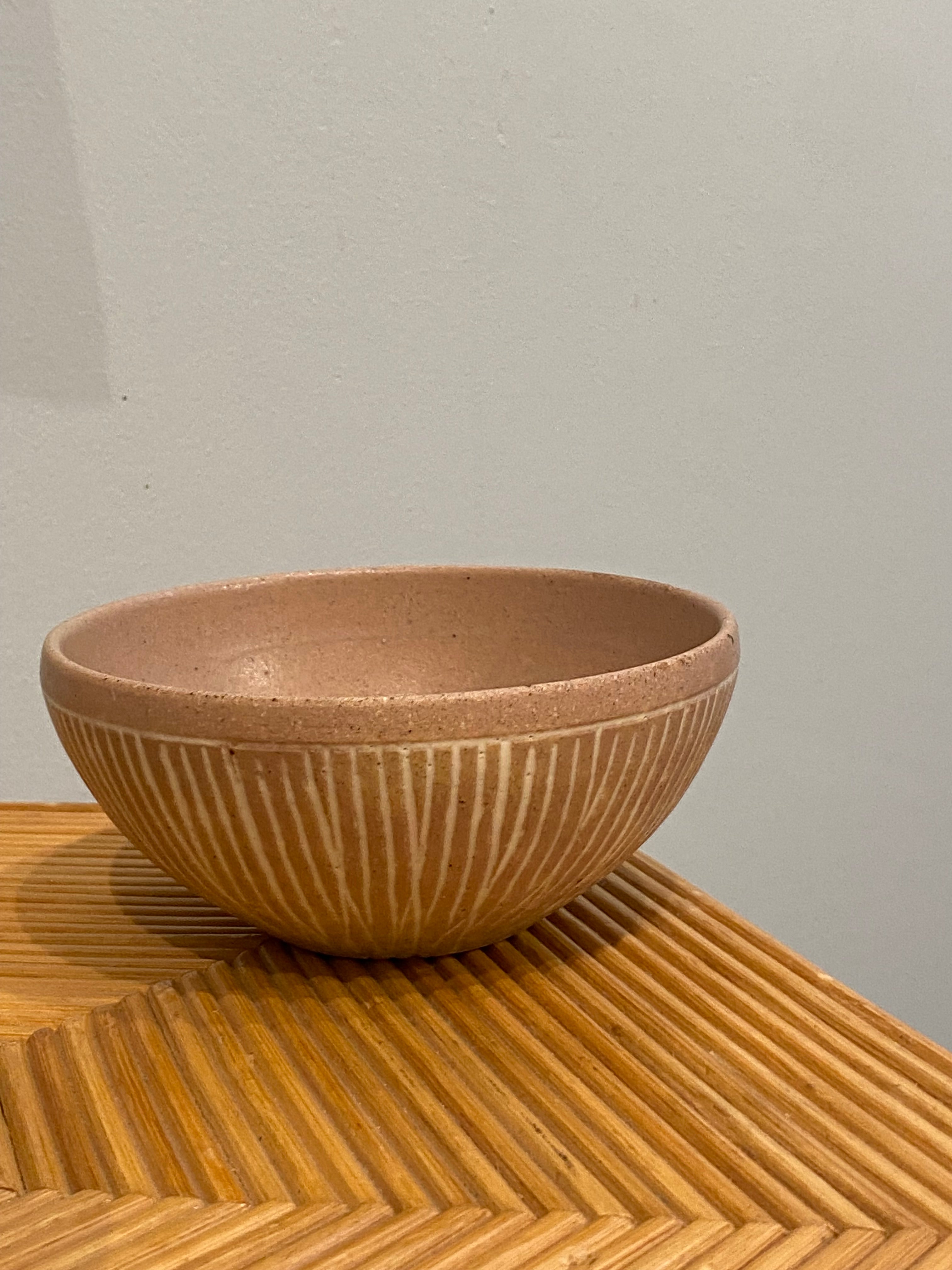 Pink bowl with white grooves