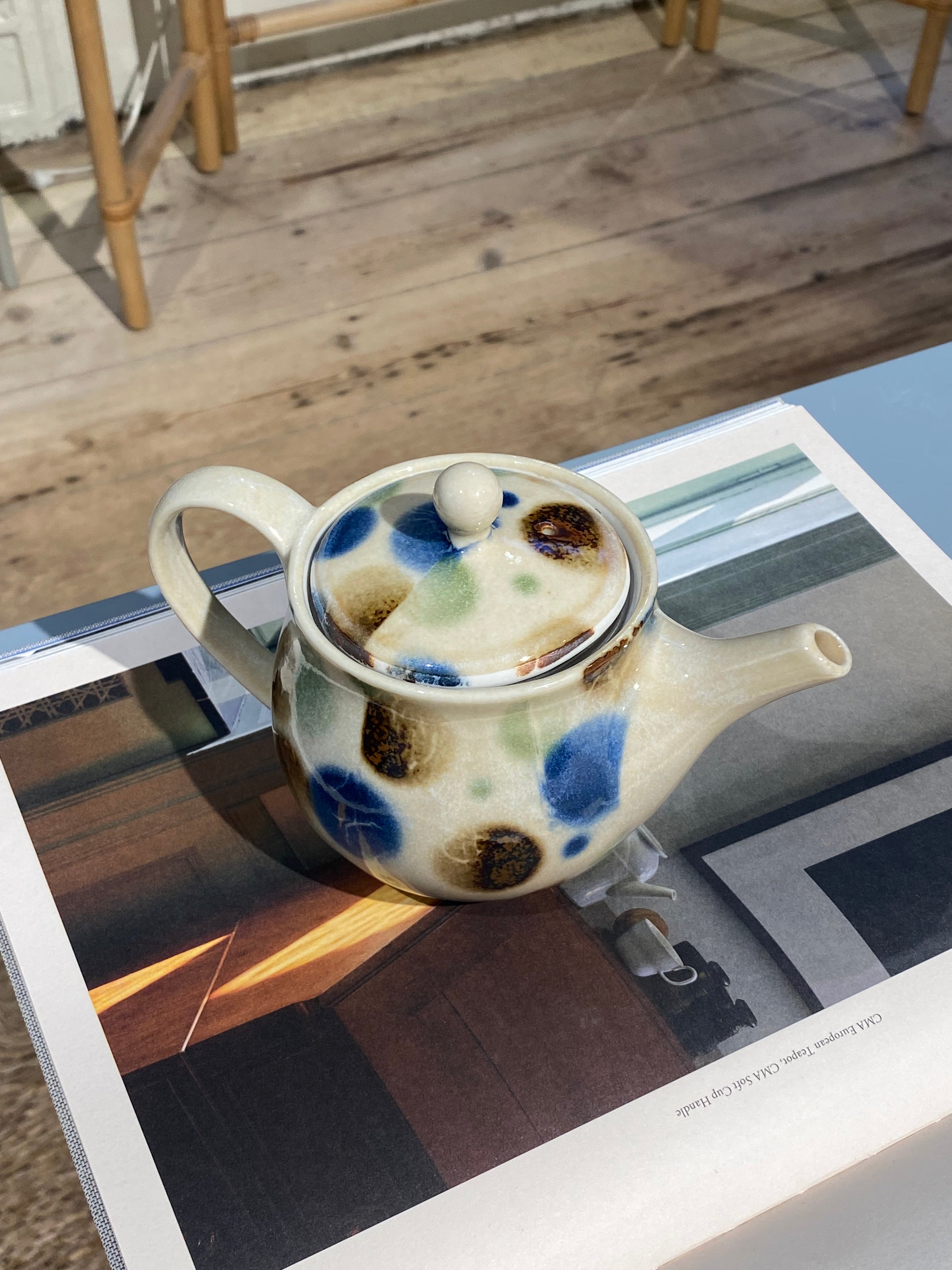 Small teapot with blue, brown and green dots