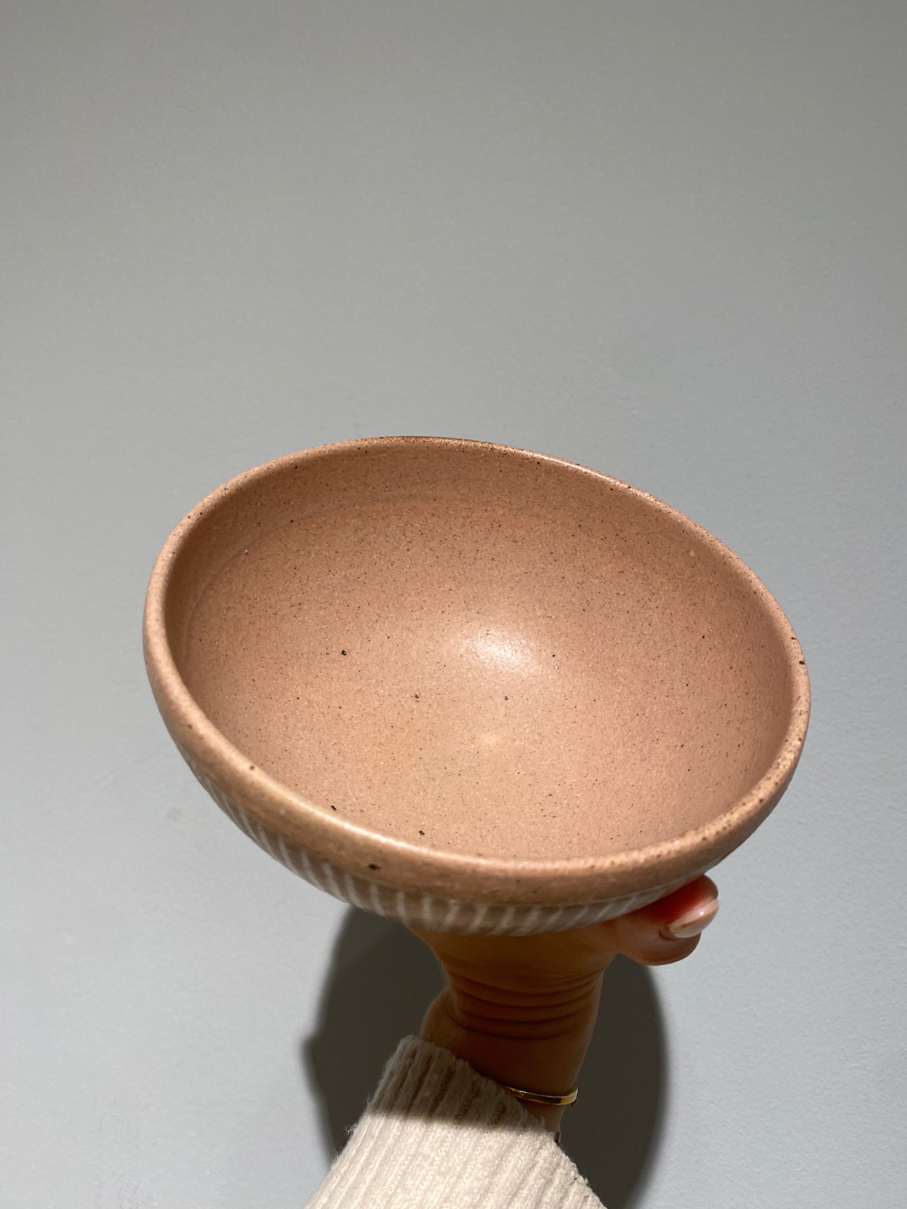 Pink bowl with white grooves
