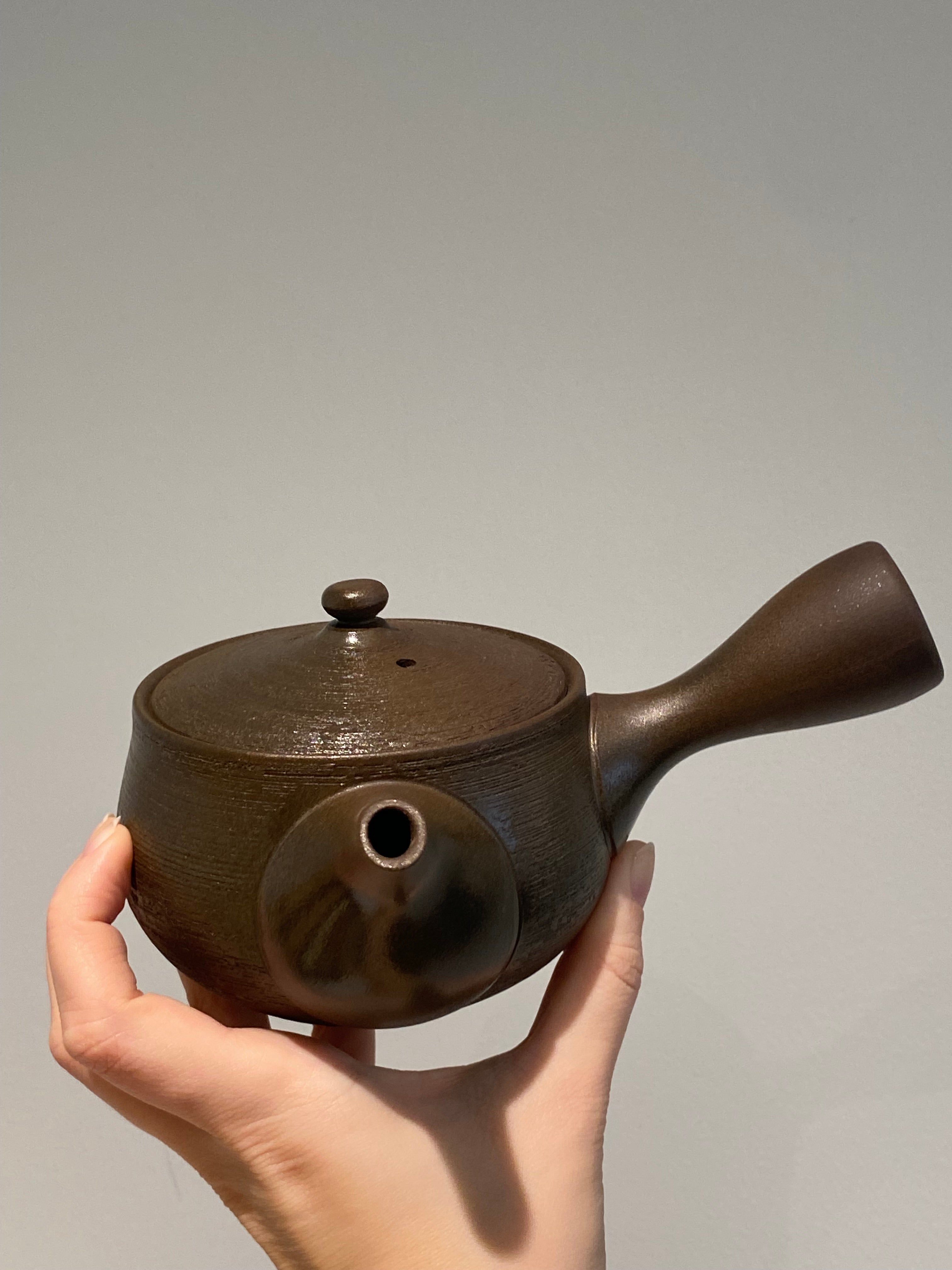 Rustic dark brown teapot with handle
