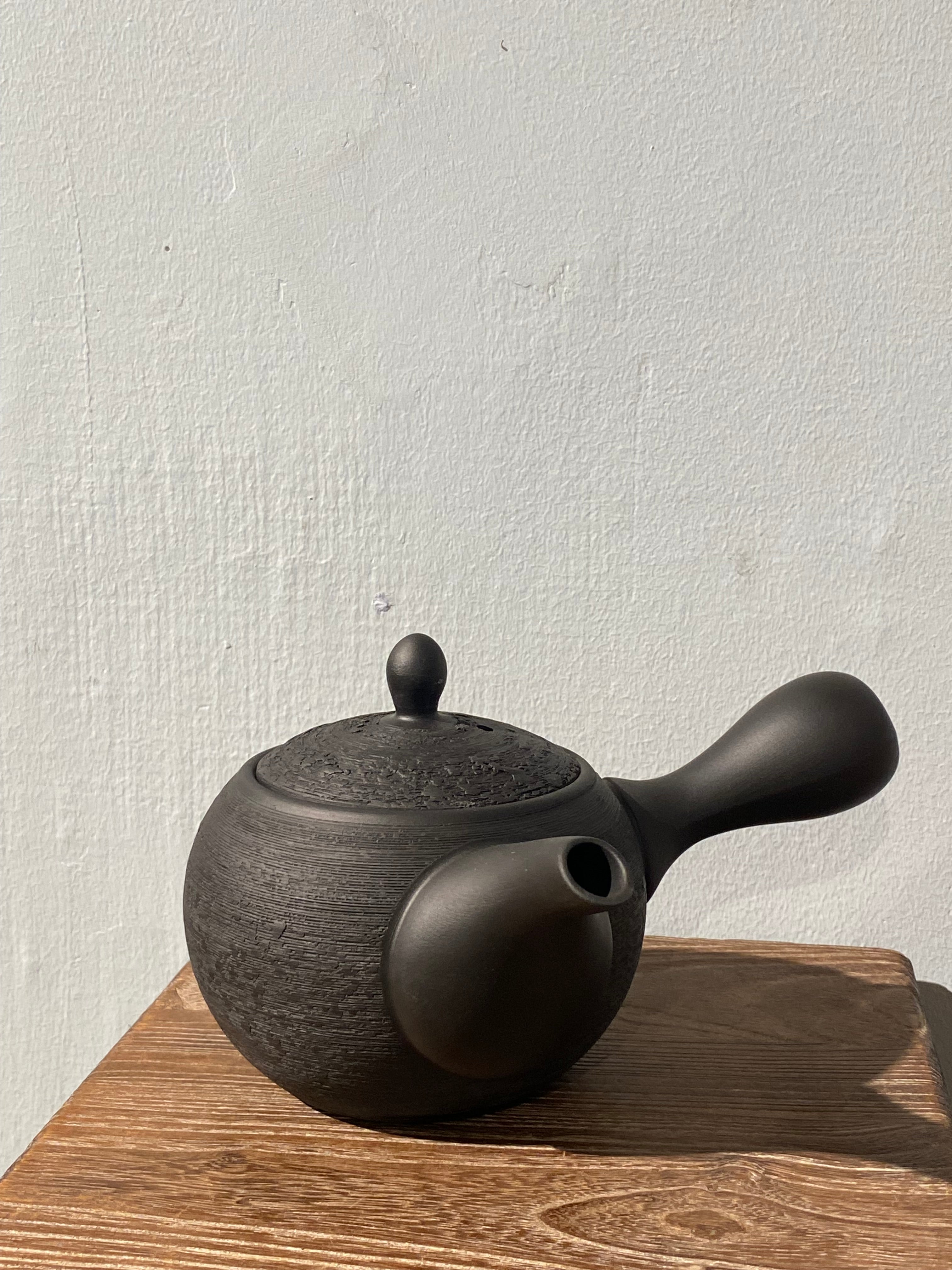 Rustic black teapot with handle