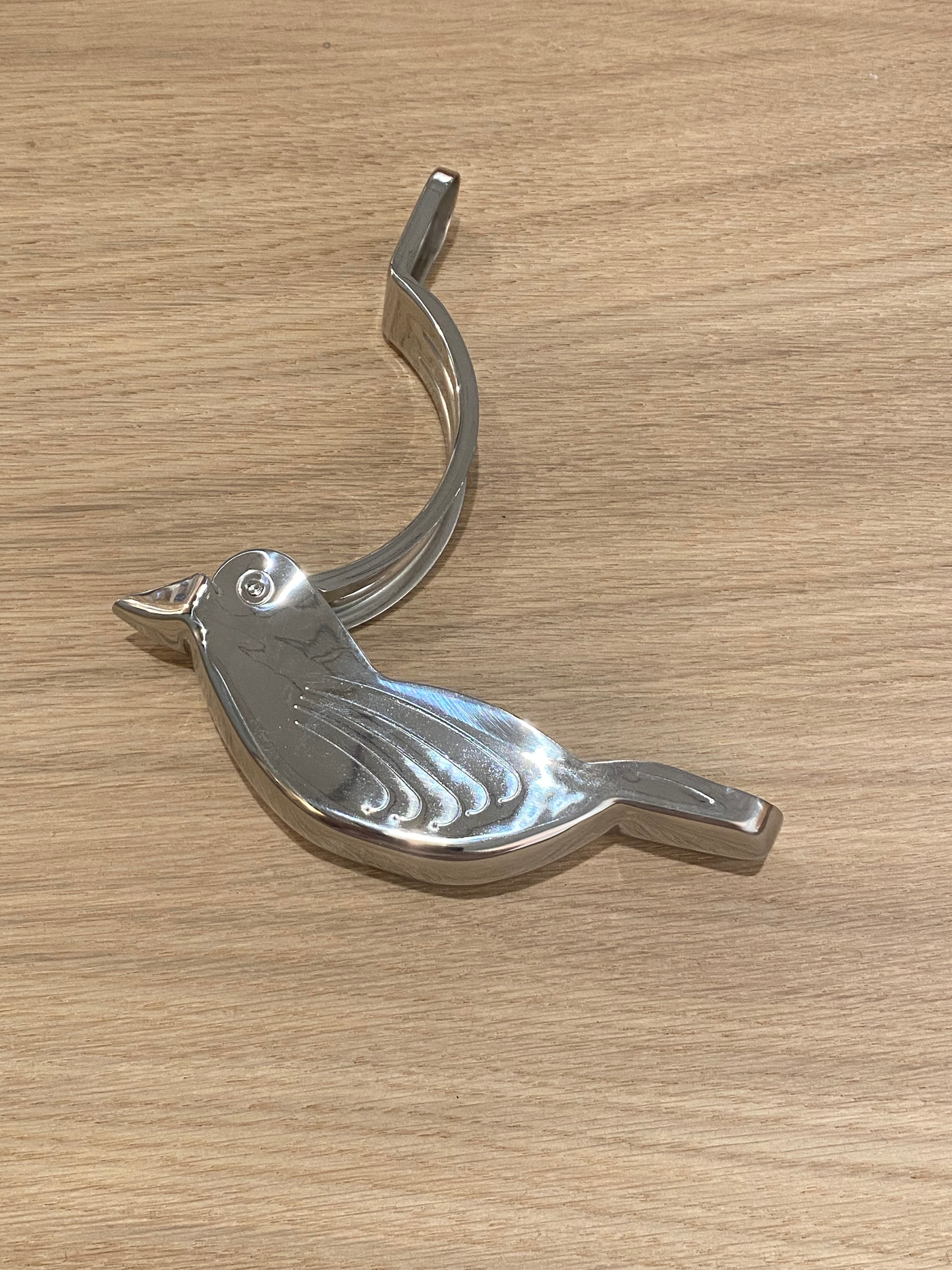 Citrus press in stainless steel with bird motif