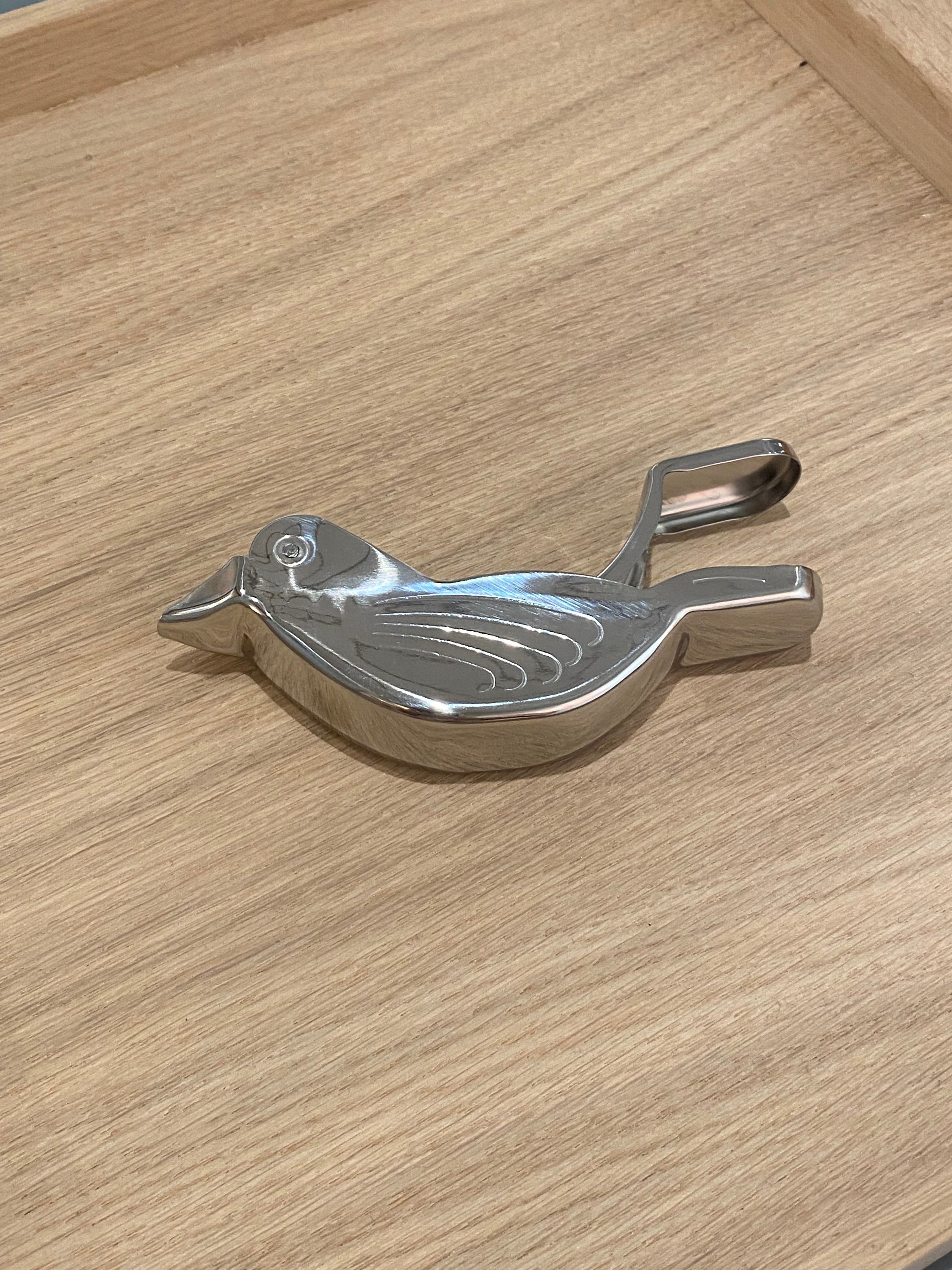 Citrus press in stainless steel with bird motif