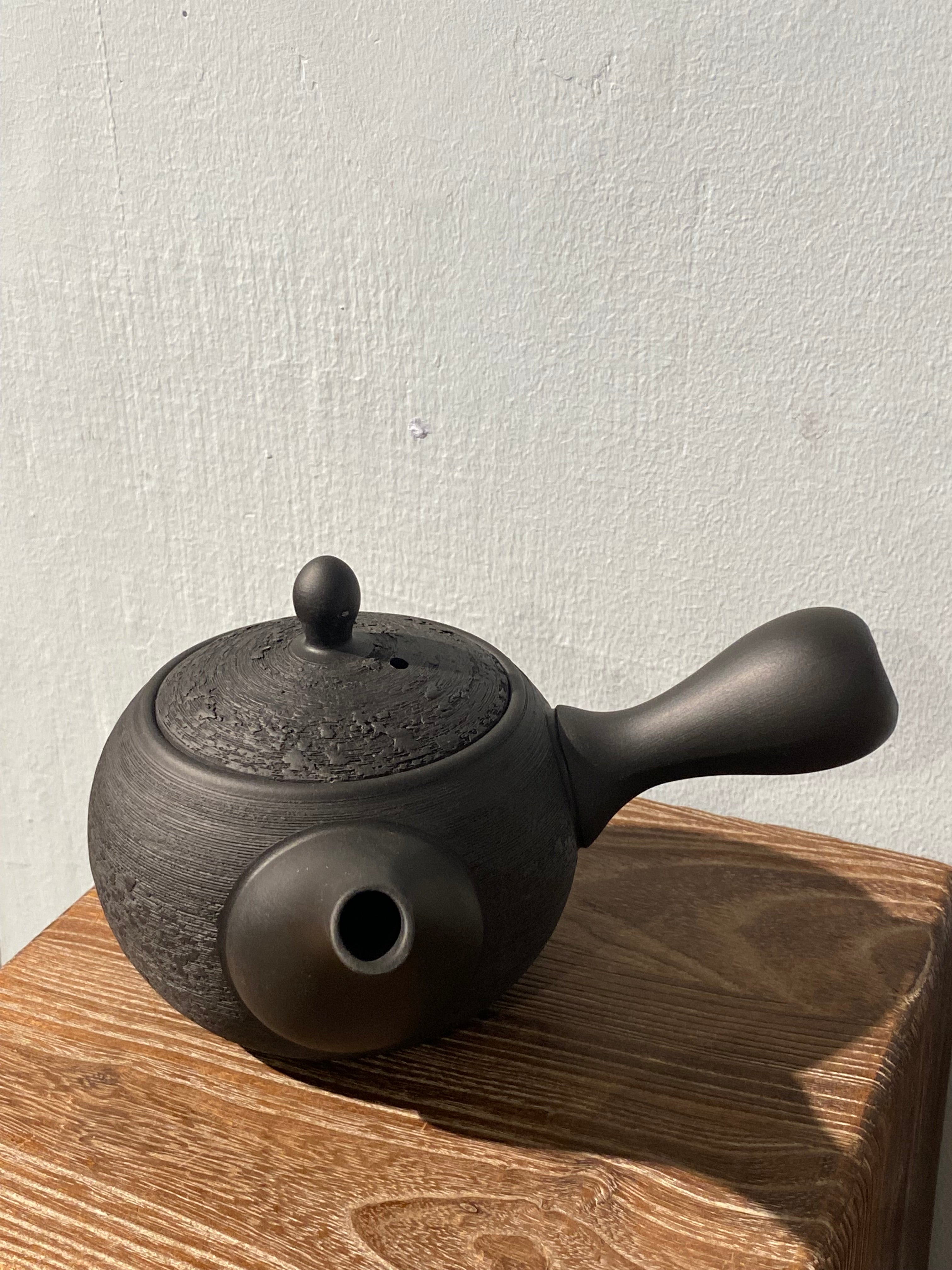 Rustic black teapot with handle