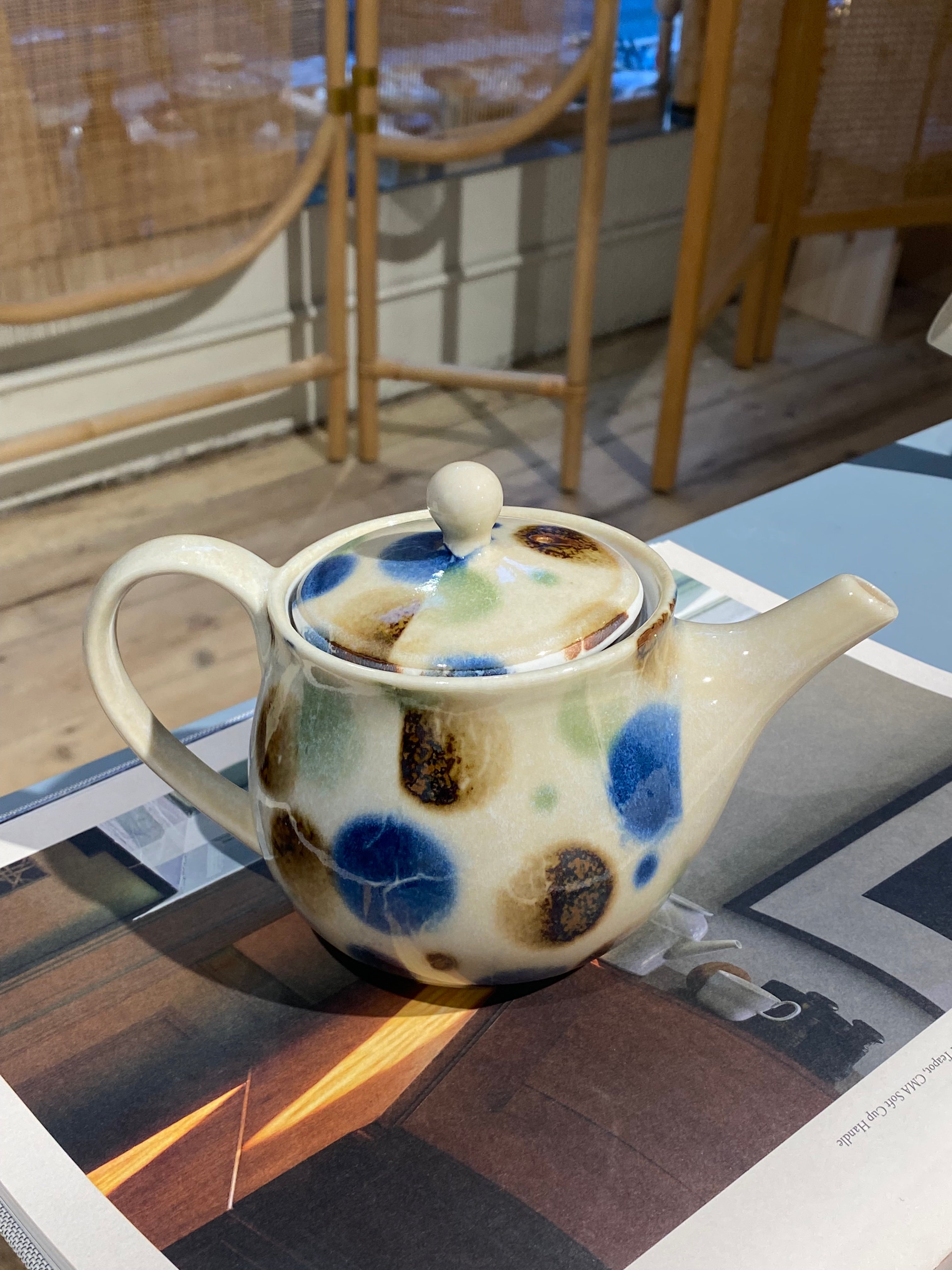 Small teapot with blue, brown and green dots