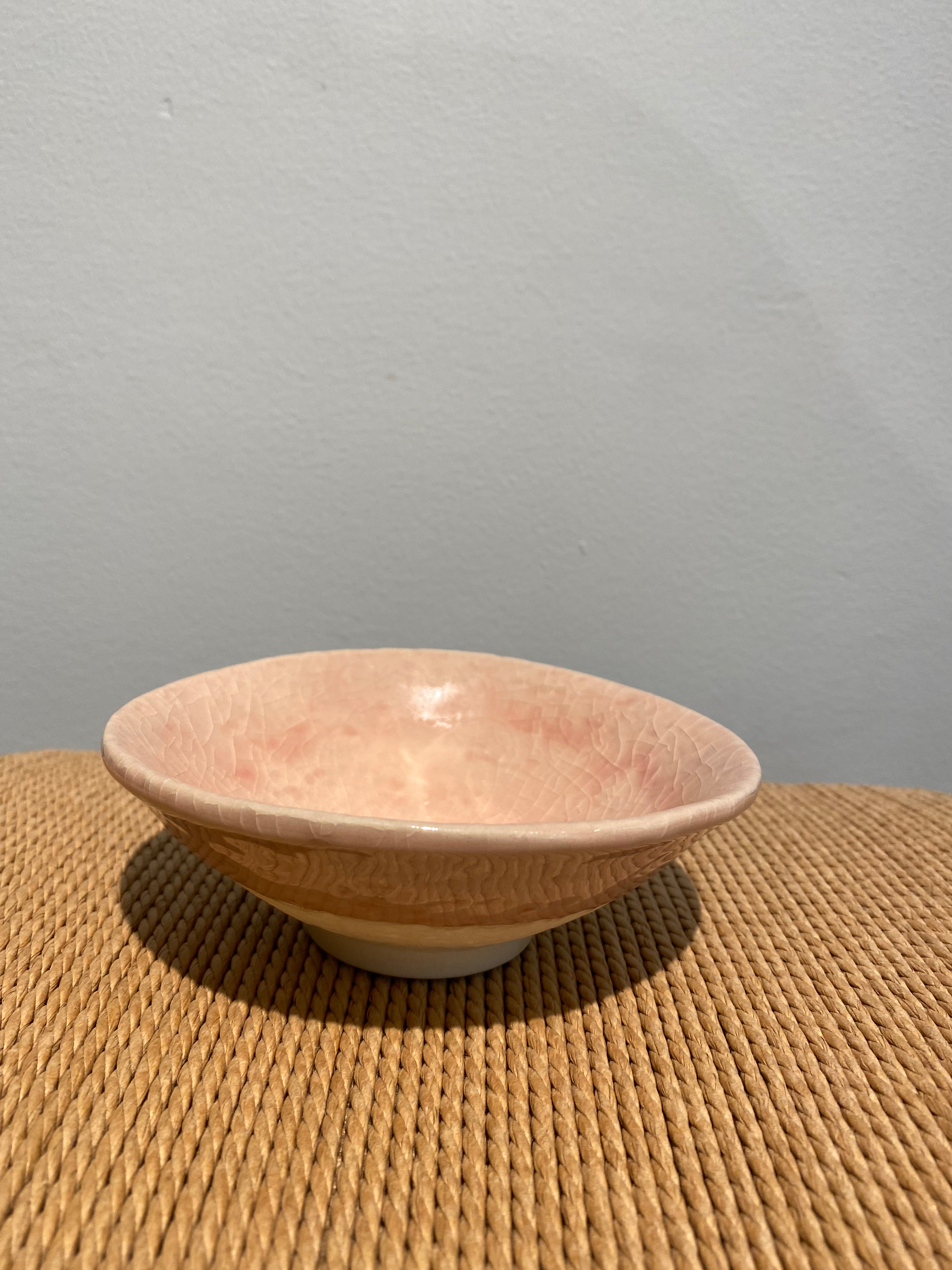 Bowl with pink glaze and cracked texture